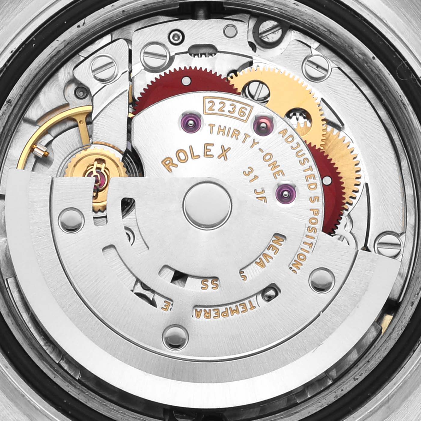 The image shows a close-up view of the movement components of a Rolex Datejust 279173 Women's Steel and Gold (two tone) Champagne Dial 279173 Women's Steel and Gold (two tone) Champagne Dial, highlighting gears and inscriptions.