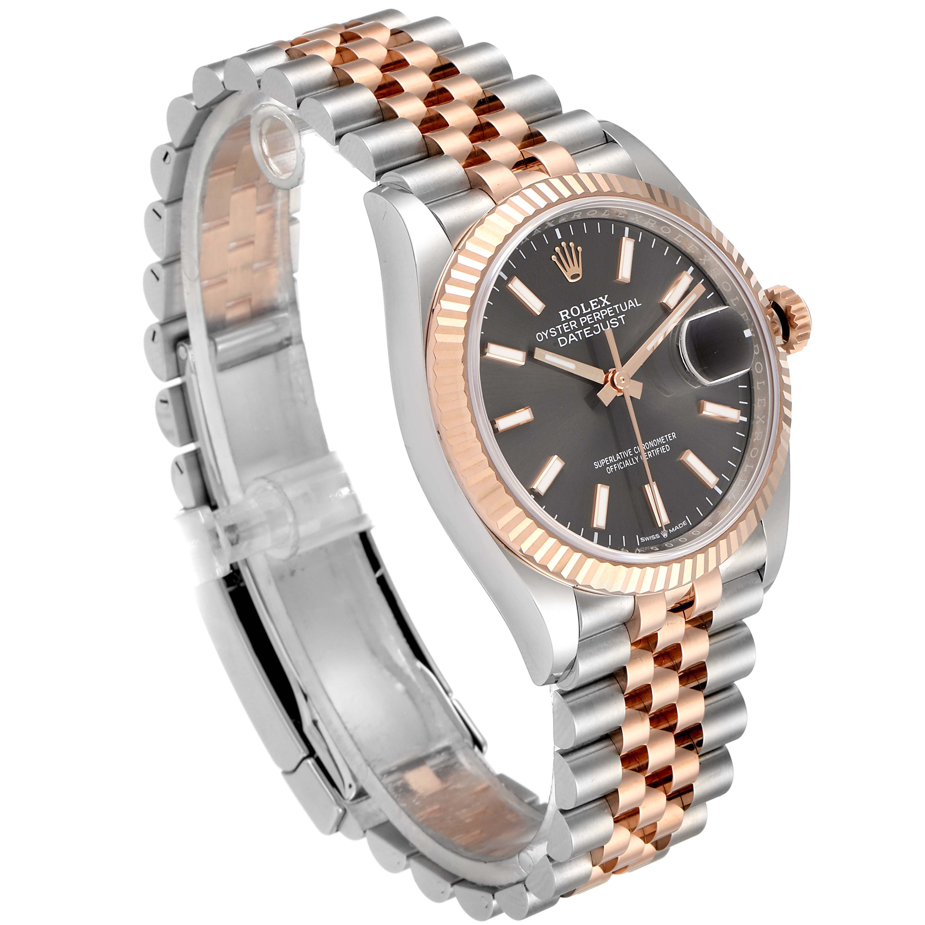 The image shows a Rolex Datejust 126231 Men
s Steel and Gold (two tone) Grey Dial 126231 Men
s Steel and Gold (two tone) Grey Dial watch from an angled side view, highlighting its two-tone bracelet, fluted bezel, and dial.