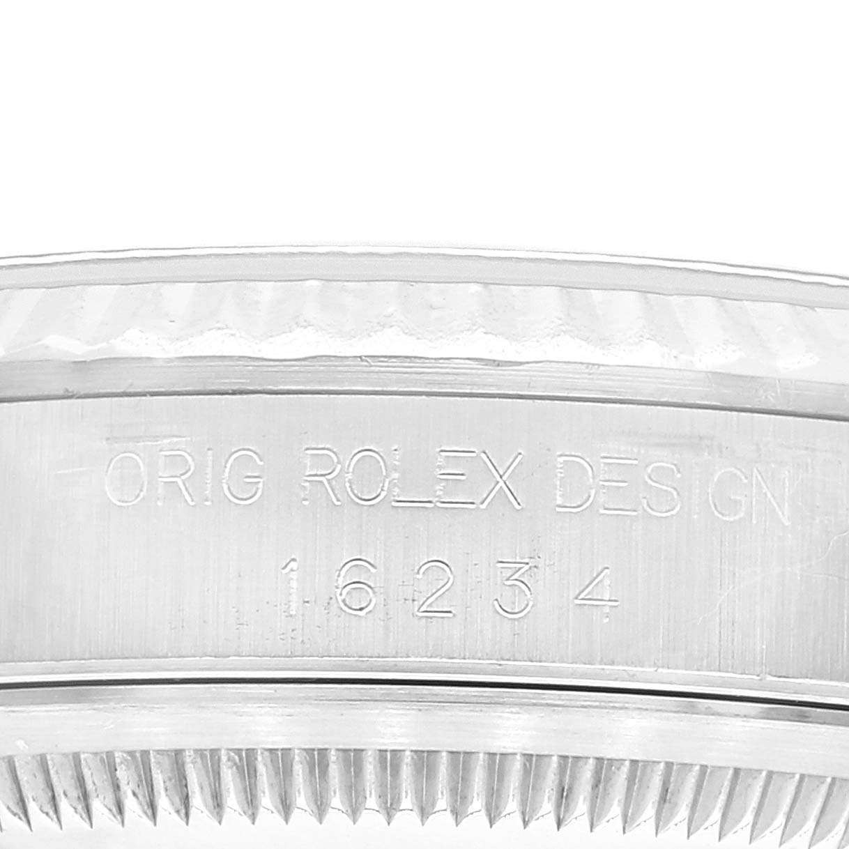 This image shows a close-up side view of the bezel and case's model engraving of a Rolex Datejust 16234 Men's Stainless Steel Blue Dial 16234 Men's Stainless Steel Blue Dial watch.