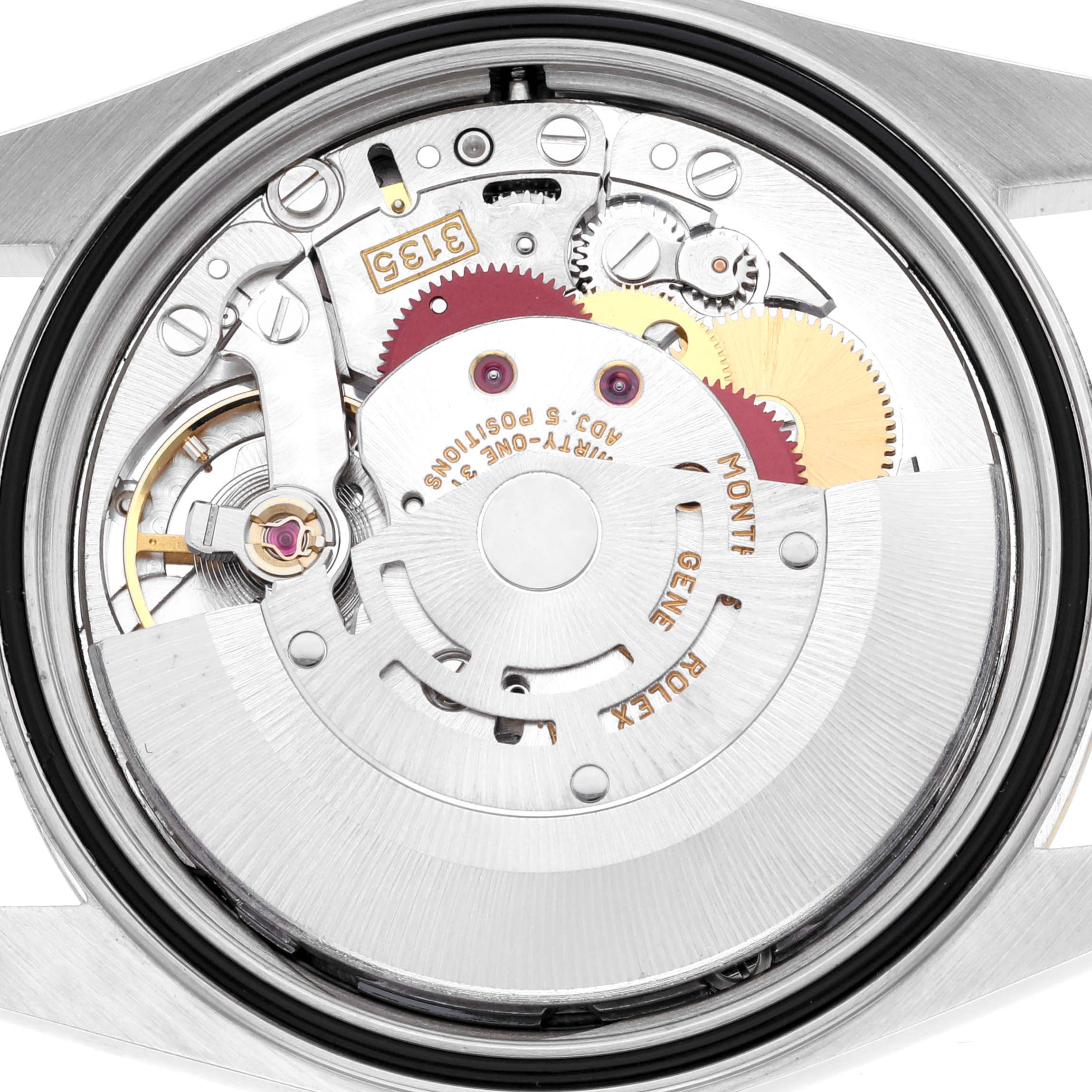 The image shows the internal mechanism of a Rolex Datejust 16233 Men's Steel and Gold (two tone) Champagne Dial 16233 Men's Steel and Gold (two tone) Champagne Dial, highlighting gears and the movement from a back angle.