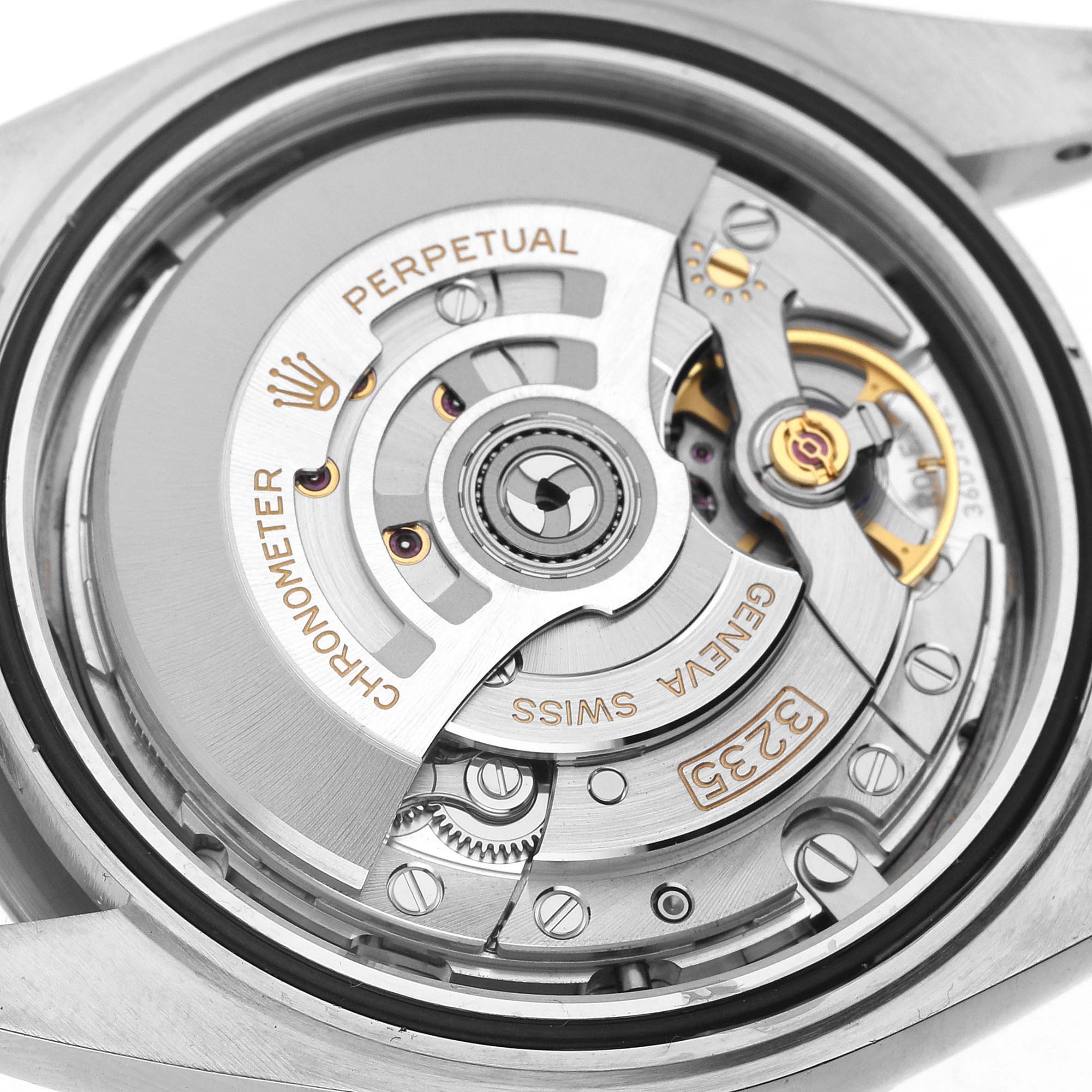 The image shows the Rolex Datejust 41 126334 Men's Stainless Steel Grey Dial movement through a transparent case back, highlighting intricate gears and the rotor.
