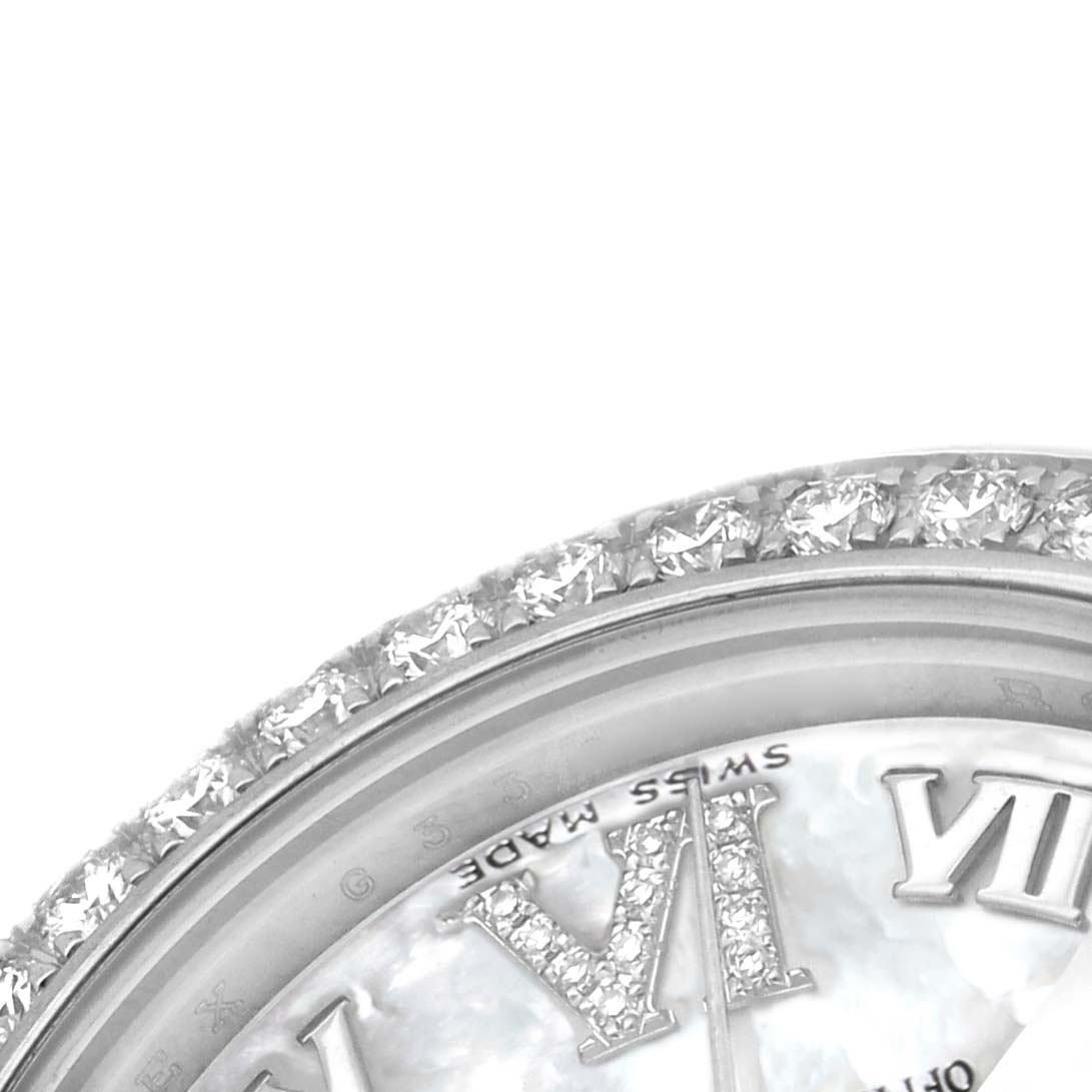 The image shows a close-up of a Rolex Datejust 178384 Women's Stainless Steel Mother of Pearl Dial watch's diamond-set bezel and part of the dial with Roman numerals.