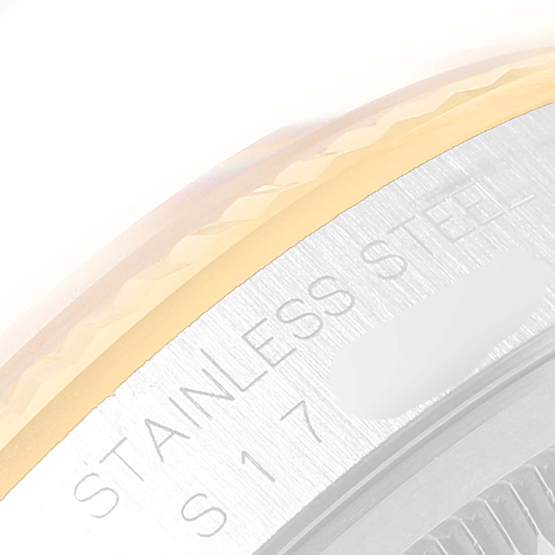 This image shows a close-up of the side and engraving on the case back of a Rolex Datejust 16233 Men
s Steel and Gold (two tone) Champagne Dial 16233 Men
s Steel and Gold (two tone) Champagne Dial watch.