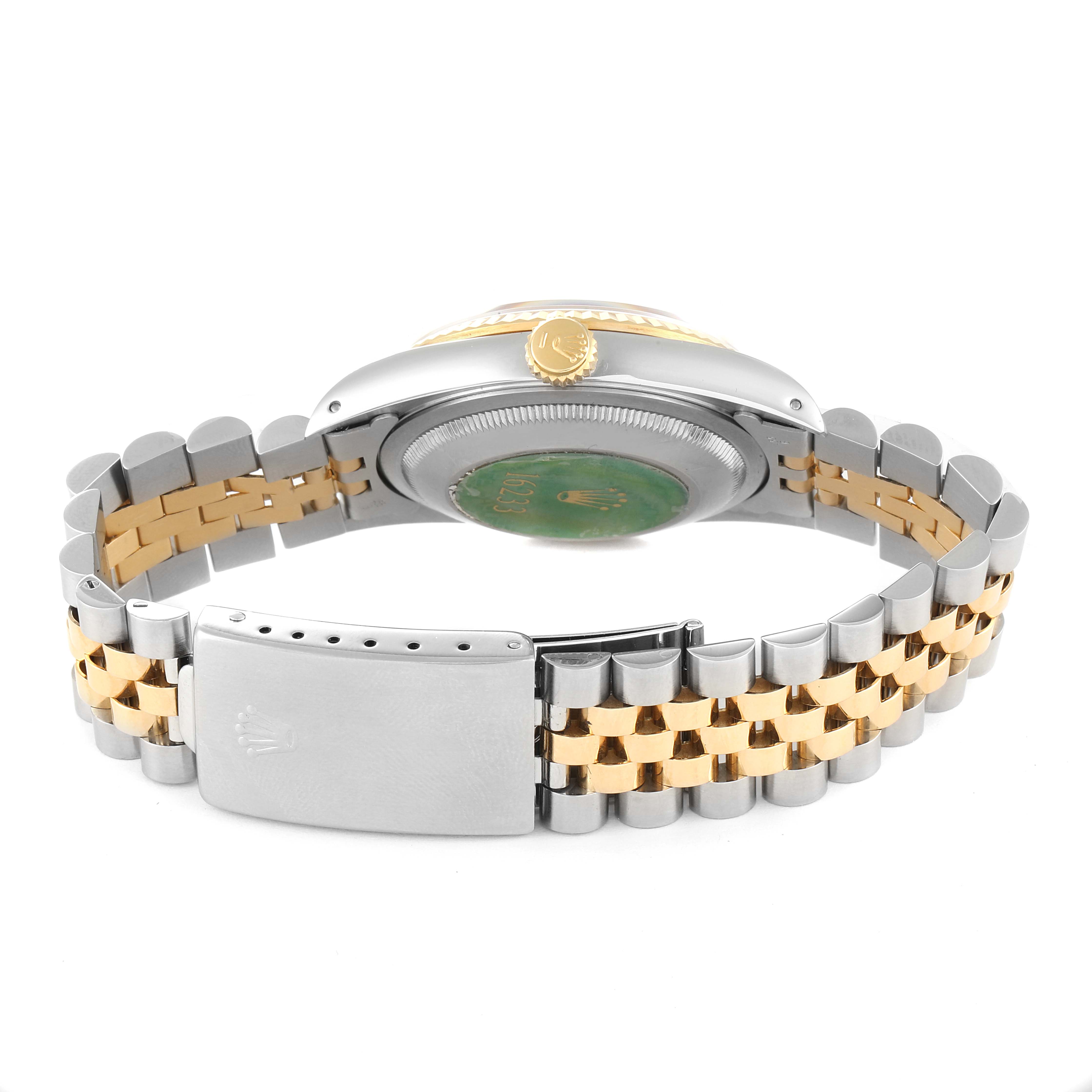 The image shows the back view of a Rolex Datejust 16233 Men
s Steel and Gold (two tone) Champagne Dial 16233 Men
s Steel and Gold (two tone) Champagne Dial watch, displaying its bracelet, clasp, case back, and crown.