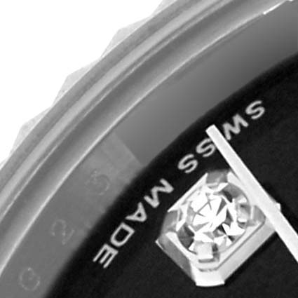 The image shows a close-up of the Rolex Datejust 179174 Women's Stainless Steel Black Dial 179174 Women's Stainless Steel Black Dial watch dial, showcasing the gem-set hour marker and part of the bezel.