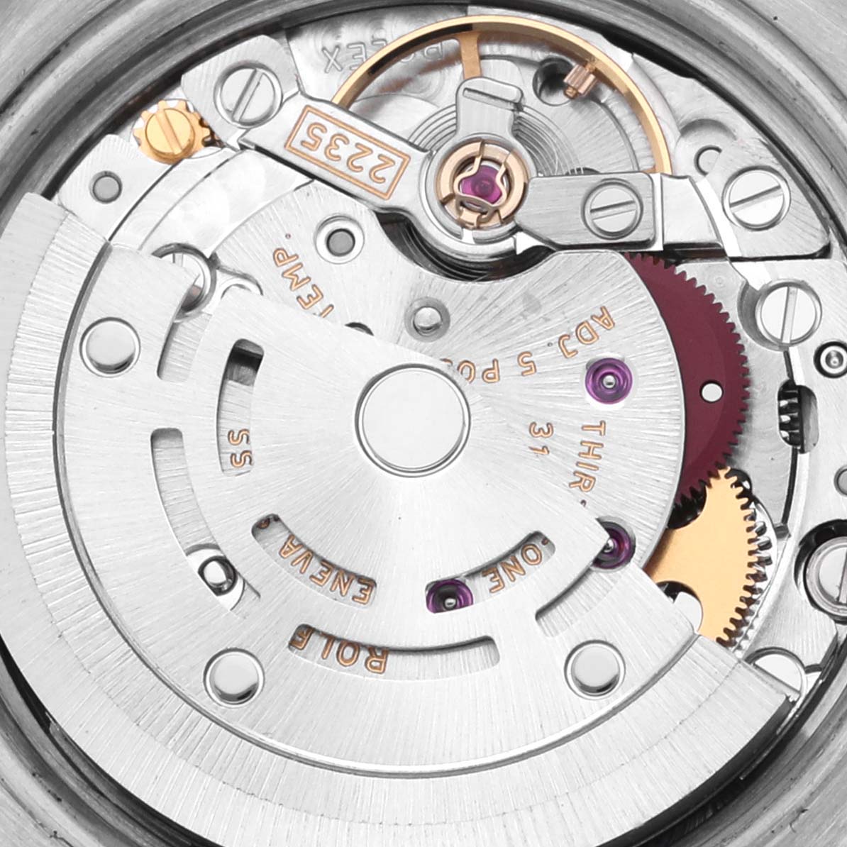 The image shows a close-up of the Rolex Datejust 179174 Women's Stainless Steel Black Dial 179174 Women's Stainless Steel Black Dial movement, highlighting the rotor and gear components.