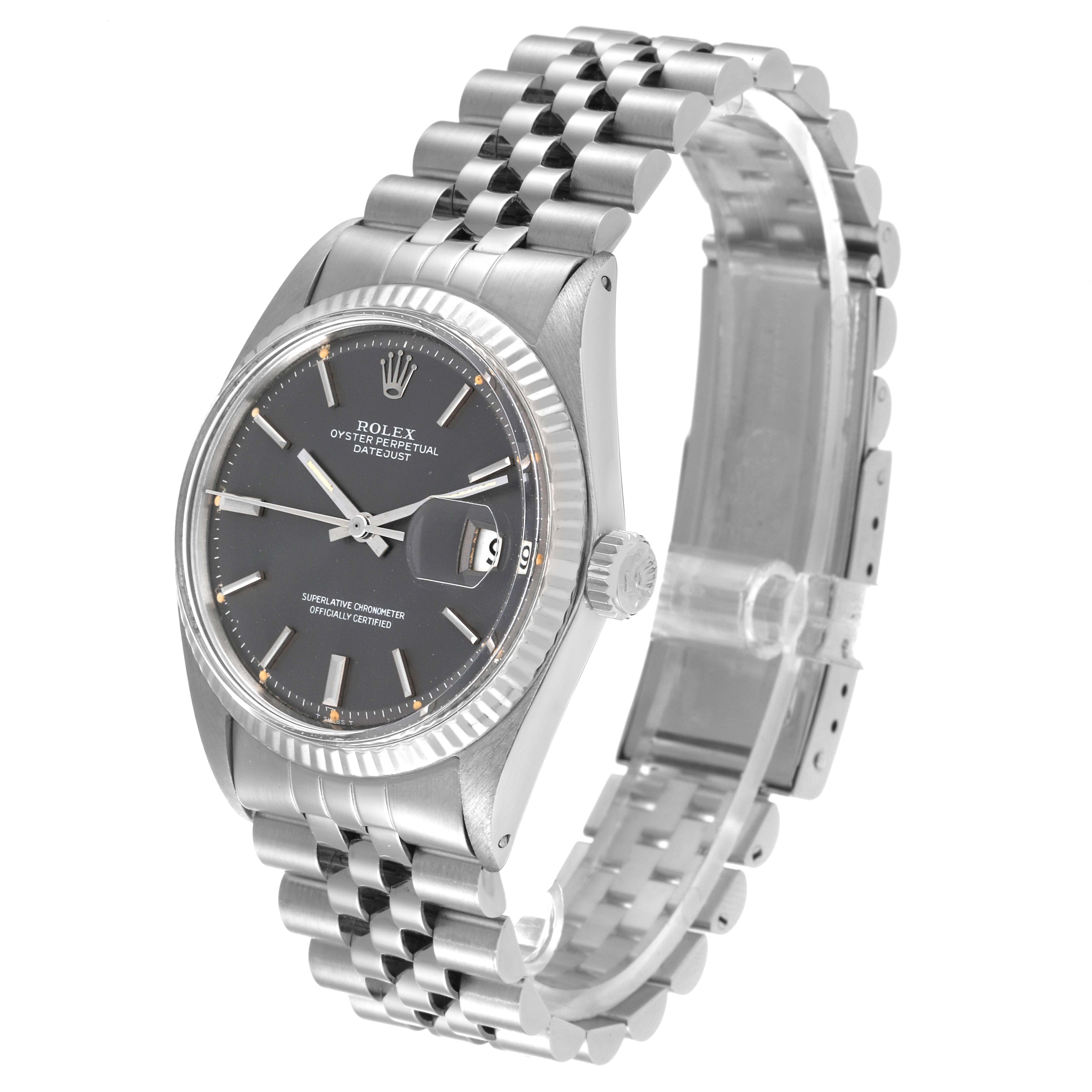 The Rolex Datejust 1601 Men's Stainless Steel Grey Dial 1601 Men's Stainless Steel Grey Dial watch is shown at a slight angle from the front, displaying the face, bezel, crown, and the beginning of its bracelet.