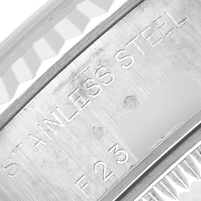 The image shows a close-up of the case edge and engraved text on a Rolex Datejust 79174 Women's Stainless Steel Pink Dial 79174 Women's Stainless Steel Pink Dial watch.