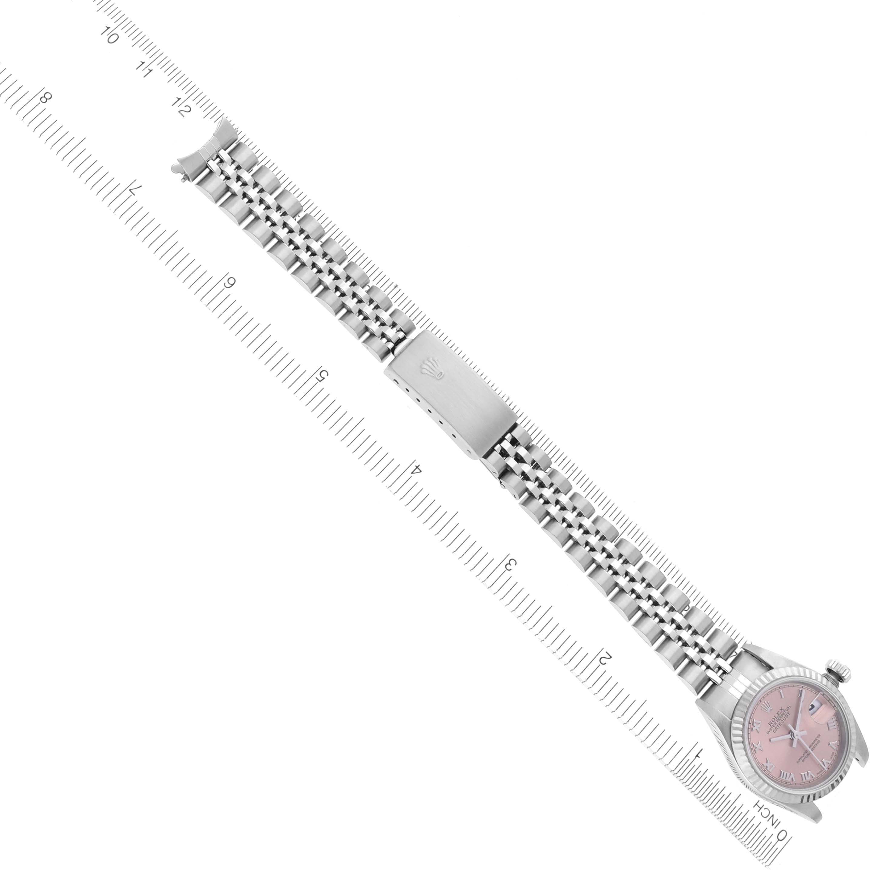 The Rolex Datejust 79174 Women's Stainless Steel Pink Dial 79174 Women's Stainless Steel Pink Dial watch is shown in a top-down angle, featuring the face, bezel, bracelet, and clasp.