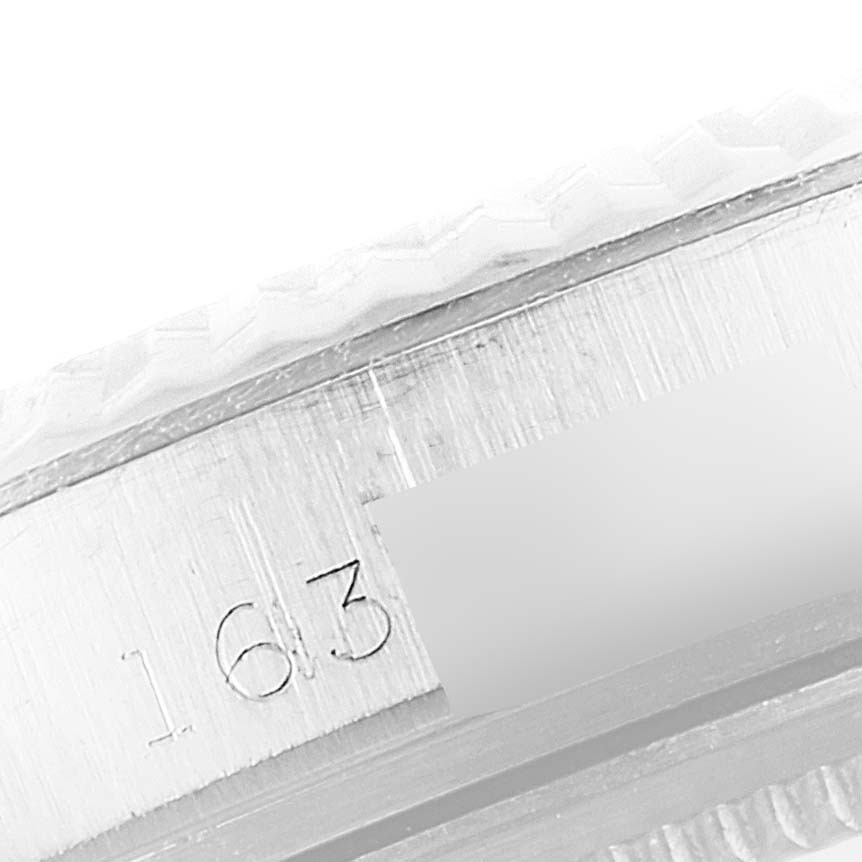 The image shows a close-up of the engraved bezel edge and the model number of the Rolex Vintage Collection 1601 Men
s Stainless Steel Silver Dial 1601 Men
s Stainless Steel Silver Dial watch.