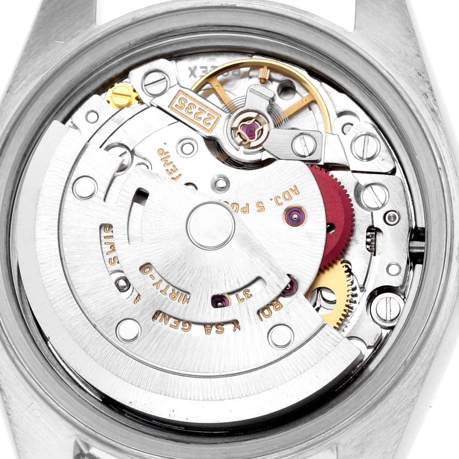 The image shows a close-up of the movement inside a Rolex Datejust 79174 Women's Stainless Steel Silver Dial 79174 Women's Stainless Steel Silver Dial watch, highlighting gears and the rotor.