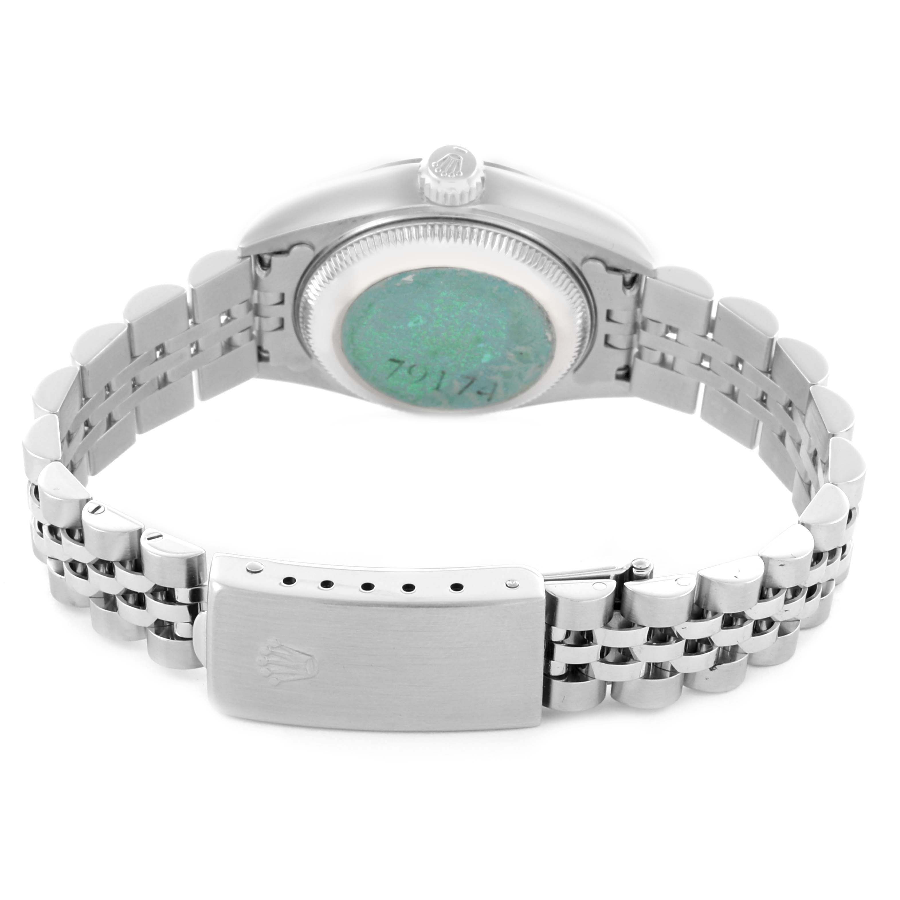 The image shows a Rolex Datejust 79174 Women's Stainless Steel Silver Dial 79174 Women's Stainless Steel Silver Dial watch from the back, highlighting the case back, crown, and bracelet clasp.