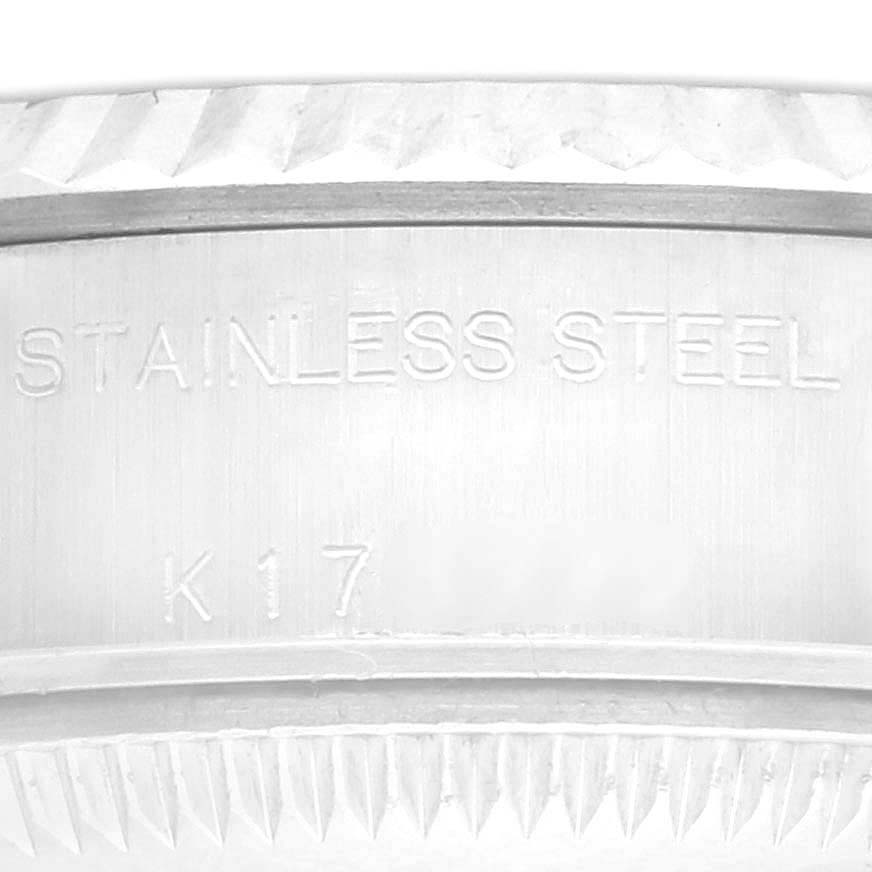 The image shows a close-up of the case edge, bezel, and engraving of a Rolex Datejust 79174 Women's Stainless Steel Silver Dial 79174 Women's Stainless Steel Silver Dial watch.