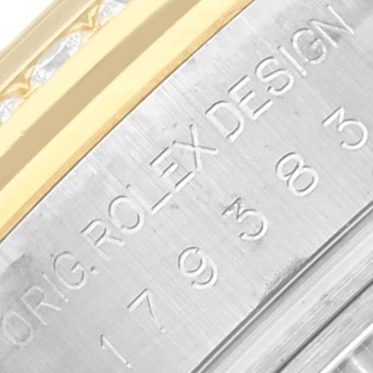 The image shows a close-up of the side of a Rolex Datejust 179383 Women's Steel and Gold (two tone) Mother of Pearl Dial 179383 Women's Steel and Gold (two tone) Mother of Pearl Dial watch, focusing on the engraved case details.