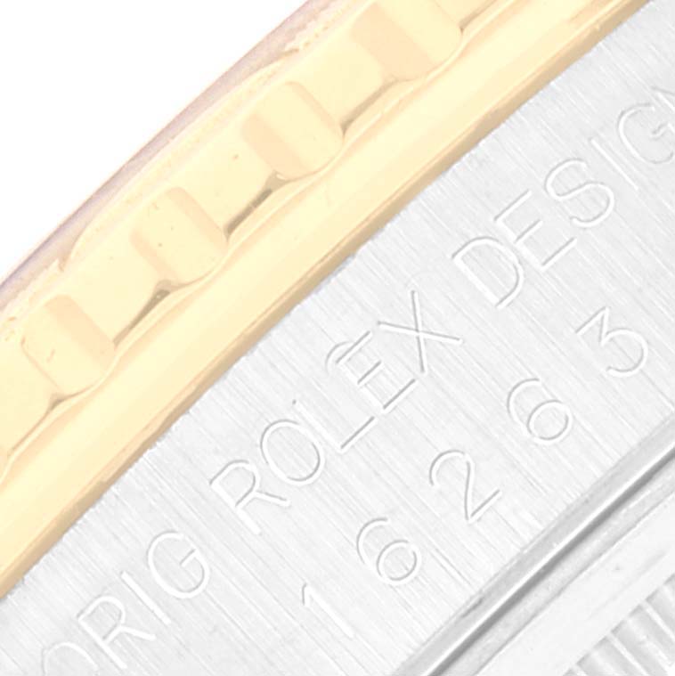 This close-up image shows part of the bezel and case engraving of a Rolex Turn-o-Graph 16263 Men's Steel and Gold (two tone) Beige Dial 16263 Men's Steel and Gold (two tone) Beige Dial watch.