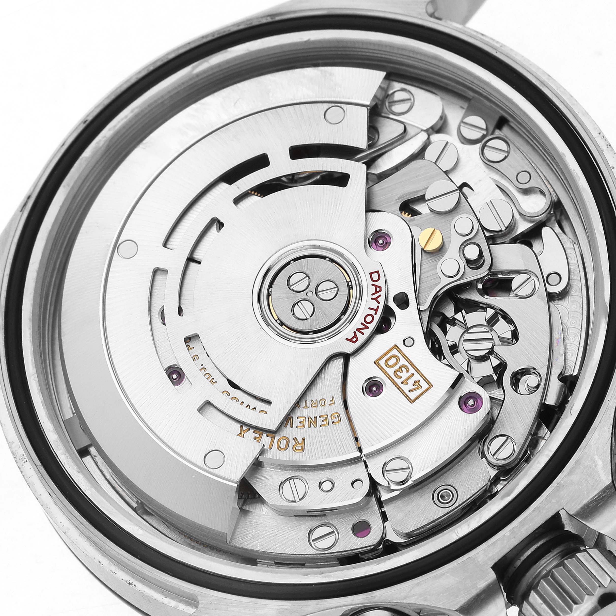 The image shows the intricate back view of a Rolex Daytona 116500 Men's Stainless Steel White Dial watch movement mechanism.