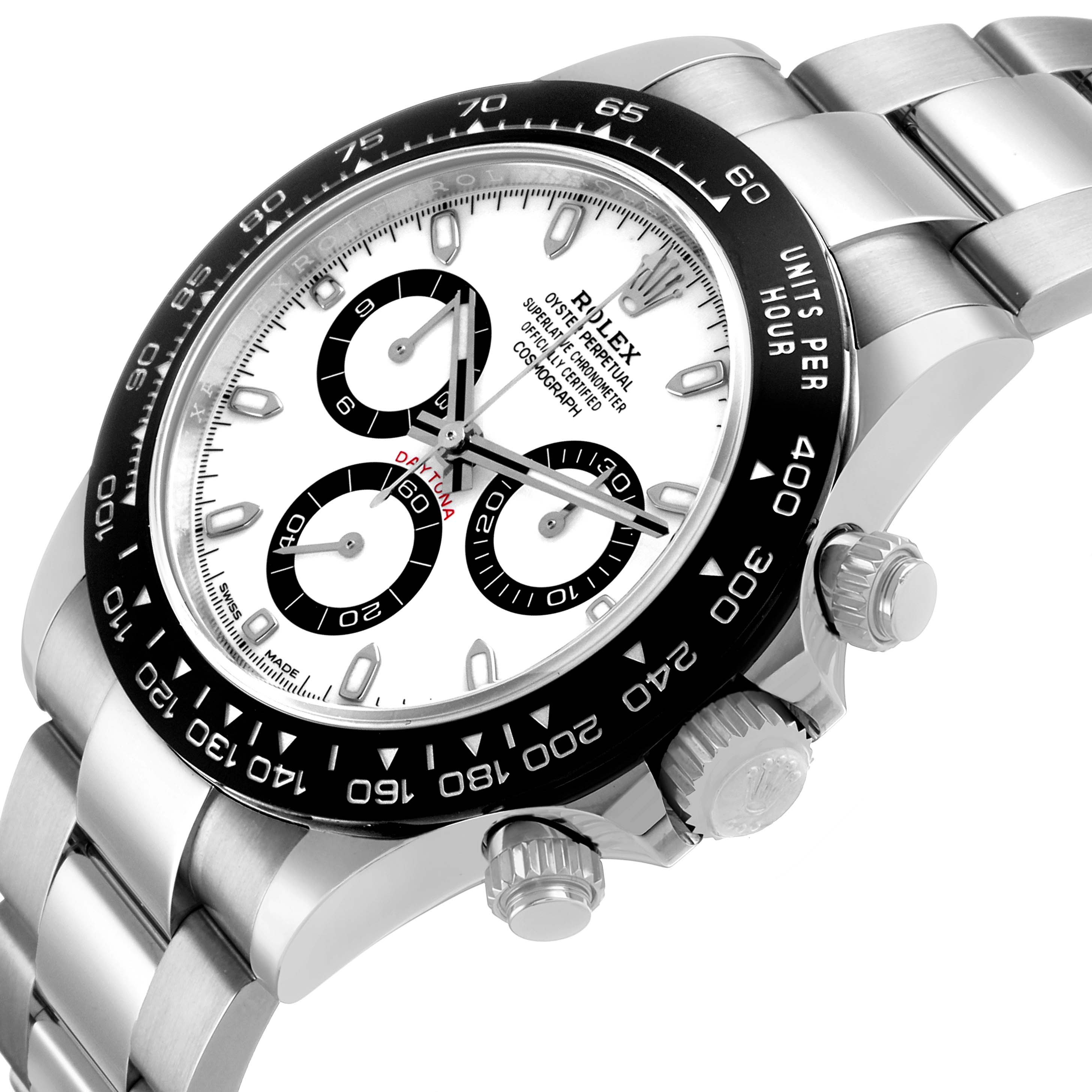 The Rolex Daytona 116500 Men's Stainless Steel White Dial watch is shown at an angled view highlighting the dial, bezel, crown, and stainless steel bracelet.