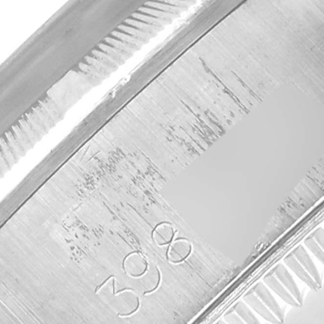 The image shows a close-up angle of the case back edge of a Rolex Oyster Perpetual 6723 Women's Stainless Steel Silver Dial 6723 Women's Stainless Steel Silver Dial, highlighting the engraved details.
