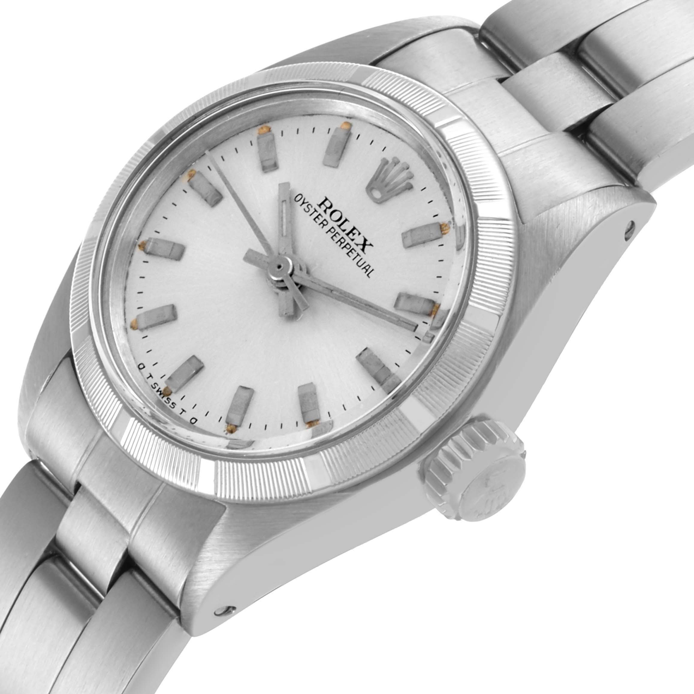 The Rolex Oyster Perpetual 6723 Women's Stainless Steel Silver Dial 6723 Women's Stainless Steel Silver Dial watch is shown at a three-quarter angle, highlighting the dial, bezel, case, crown, and bracelet.