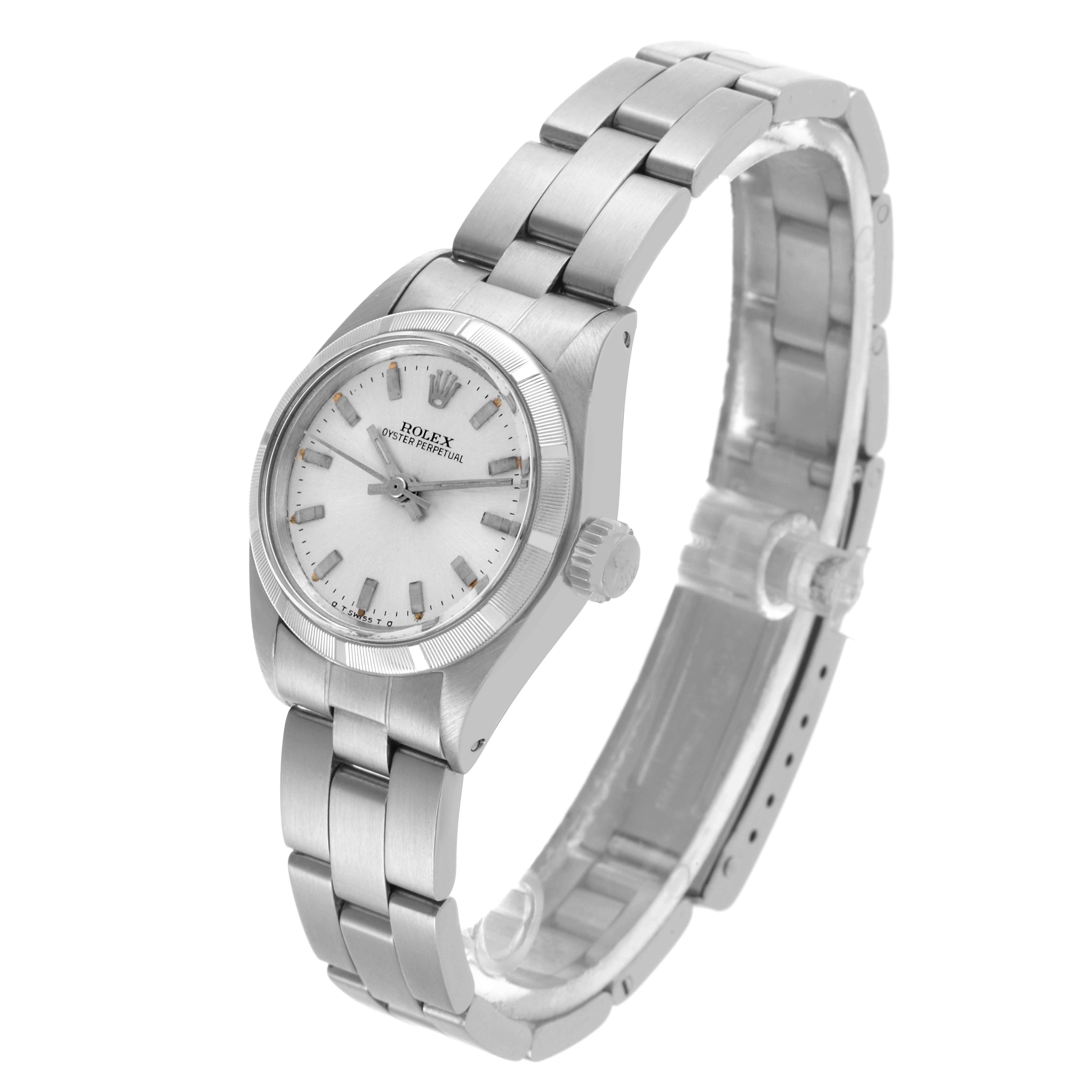 The Rolex Oyster Perpetual 6723 Women's Stainless Steel Silver Dial 6723 Women's Stainless Steel Silver Dial watch is shown from a three-quarter angle, displaying the face, bezel, bracelet, and crown.