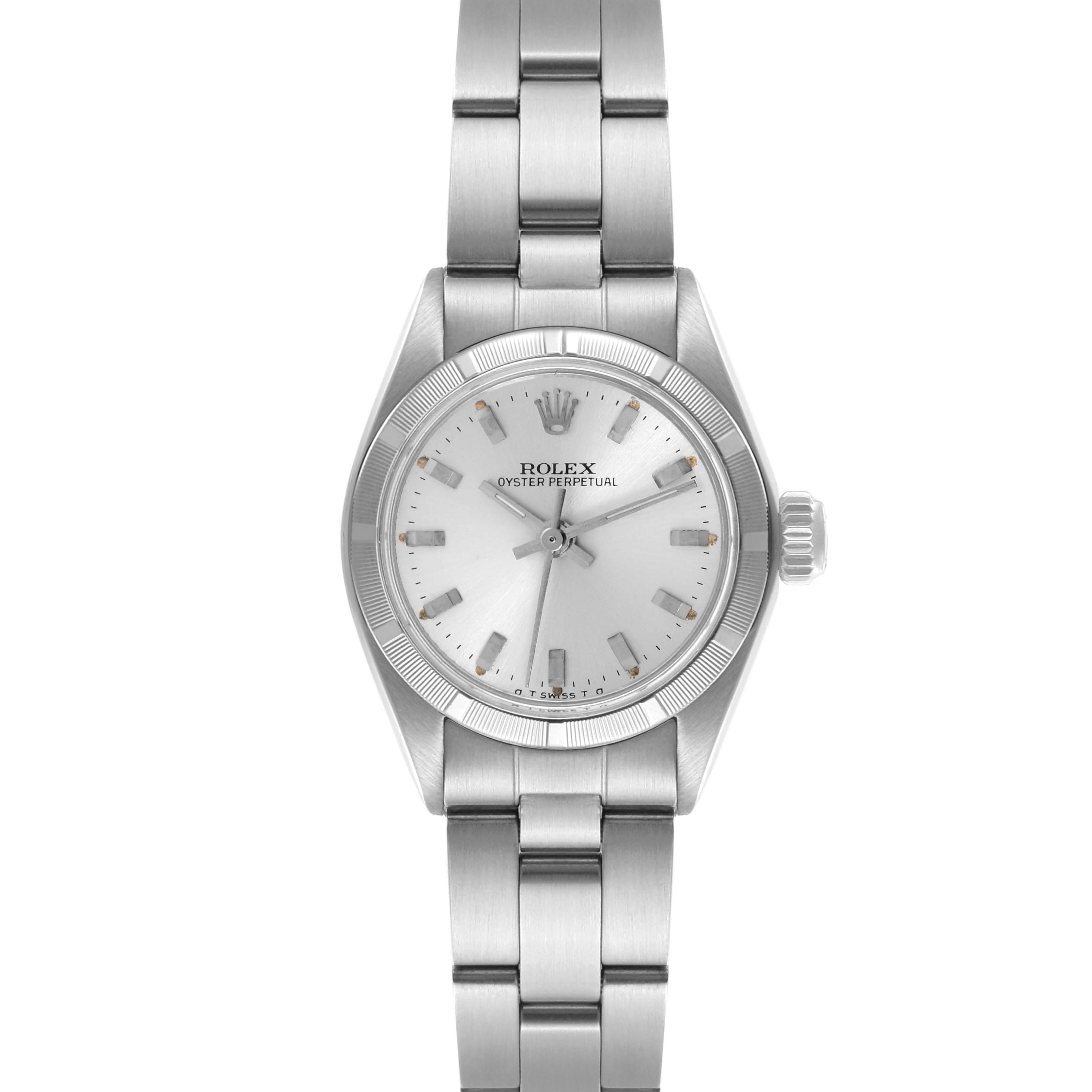 The Rolex Oyster Perpetual 6723 Women's Stainless Steel Silver Dial 6723 Women's Stainless Steel Silver Dial is shown from a top-down angle, displaying the full face, bracelet, and side crown.