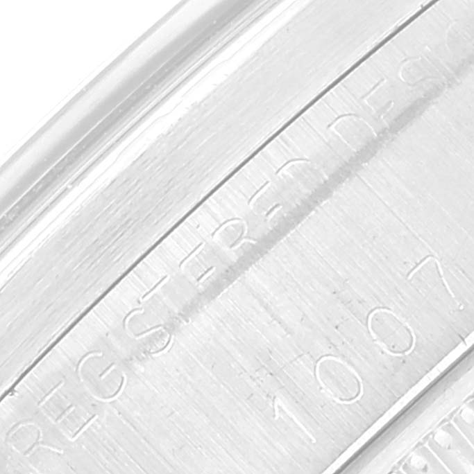 This image shows a close-up of the engraved case back of a Rolex Oyster Perpetual 1007 Men
s Stainless Steel Silver Dial 1007 Men
s Stainless Steel Silver Dial watch.