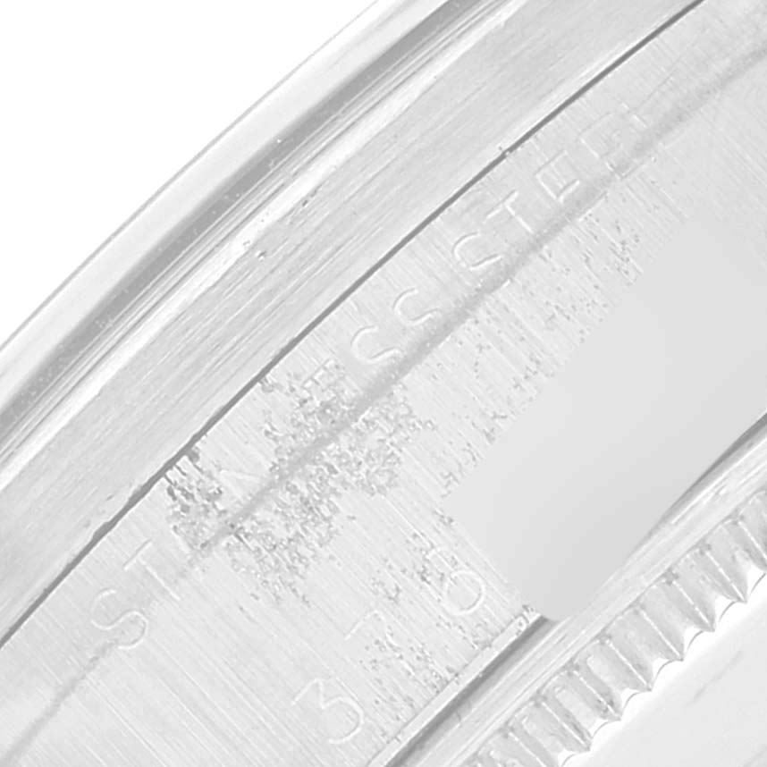 The image shows a close-up of the side of the bezel and case back of a Rolex Oyster Perpetual 1007 Men
s Stainless Steel Silver Dial 1007 Men
s Stainless Steel Silver Dial watch.