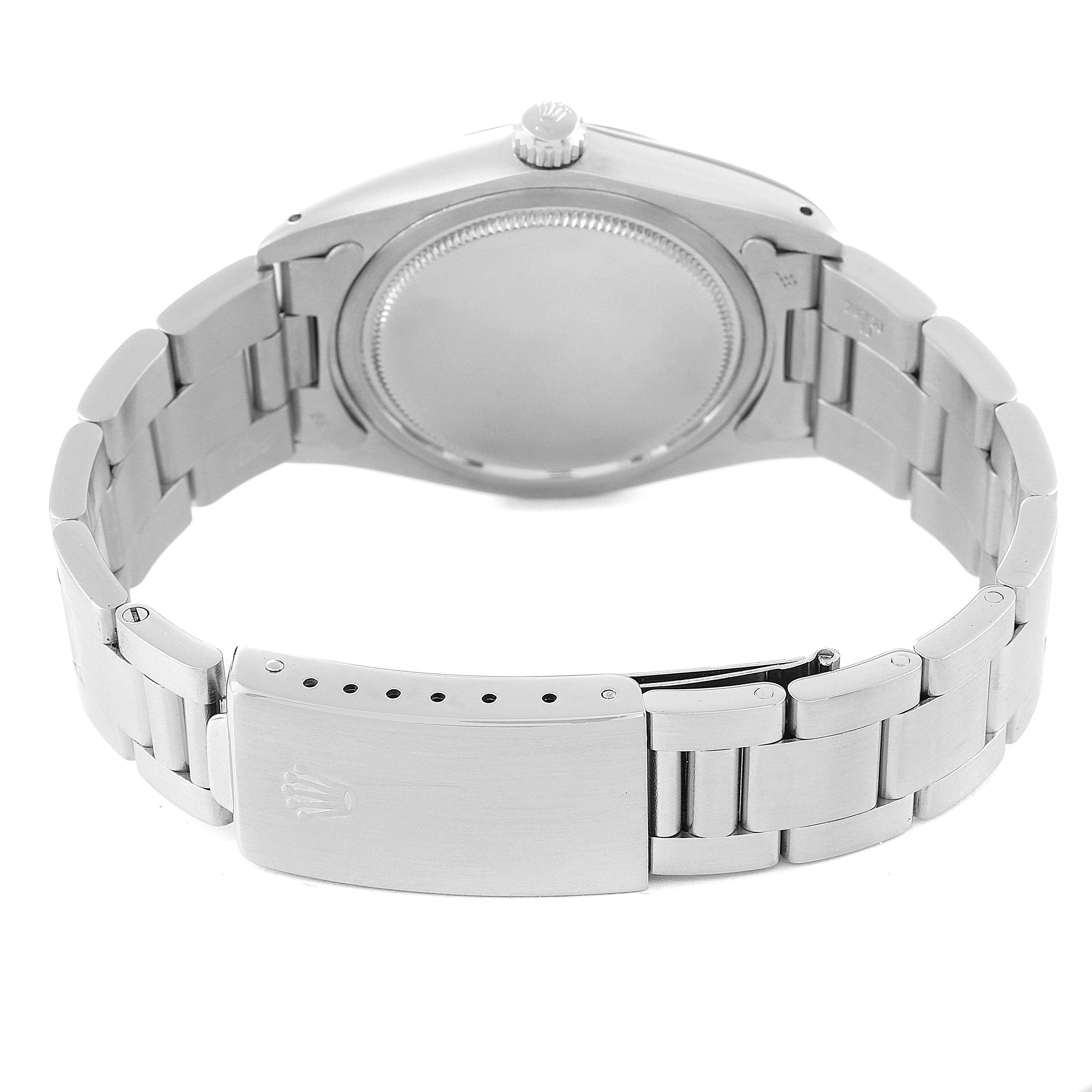 This image shows the back view of a Rolex Date 6694 Men's Stainless Steel Black Dial 6694 Men's Stainless Steel Black Dial watch, highlighting its case, crown, and bracelet.