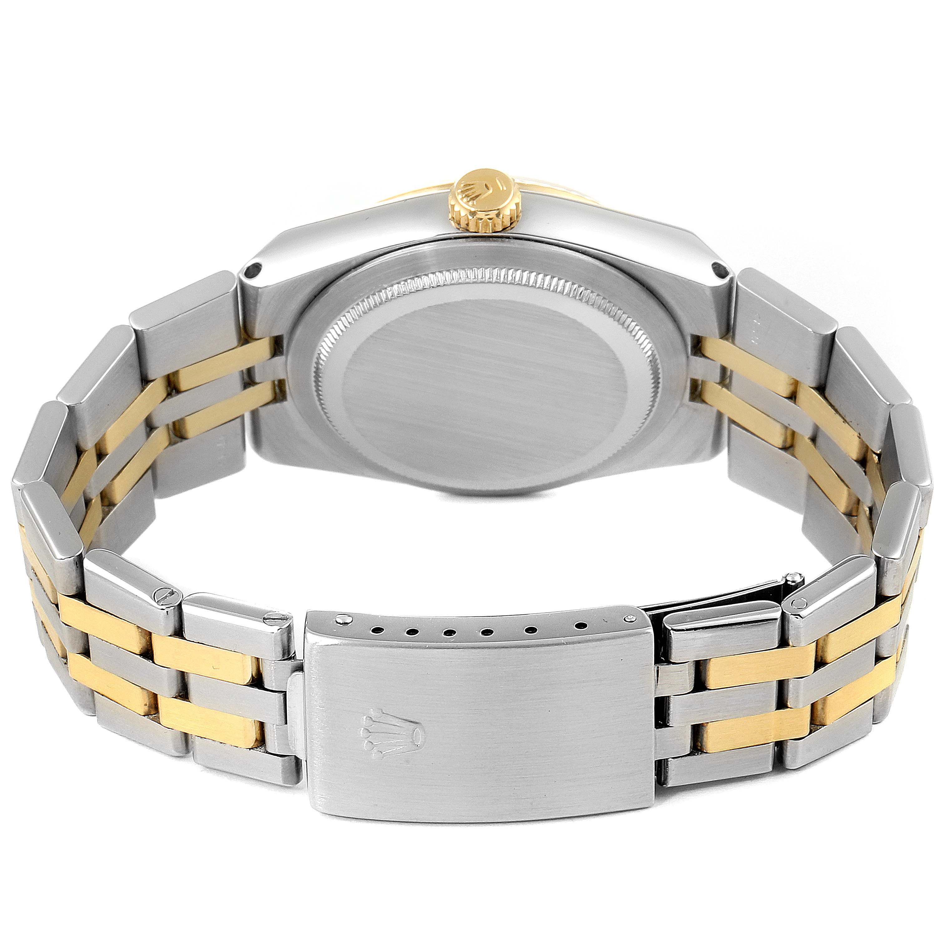 The image shows the back view of a Rolex Oysterquartz 17013 Men's Steel and Gold (two tone) Silver Dial 17013 Men's Steel and Gold (two tone) Silver Dial watch, highlighting the case, crown, caseback, and the two-tone bracelet with a clasp.