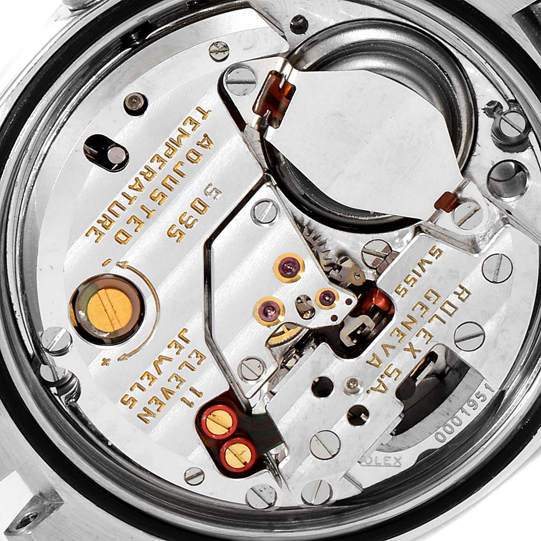 Close-up of the Rolex Oysterquartz 17013 Men's Steel and Gold (two tone) Silver Dial 17013 Men's Steel and Gold (two tone) Silver Dial watch movement, showing internal components, gears, and inscriptions.