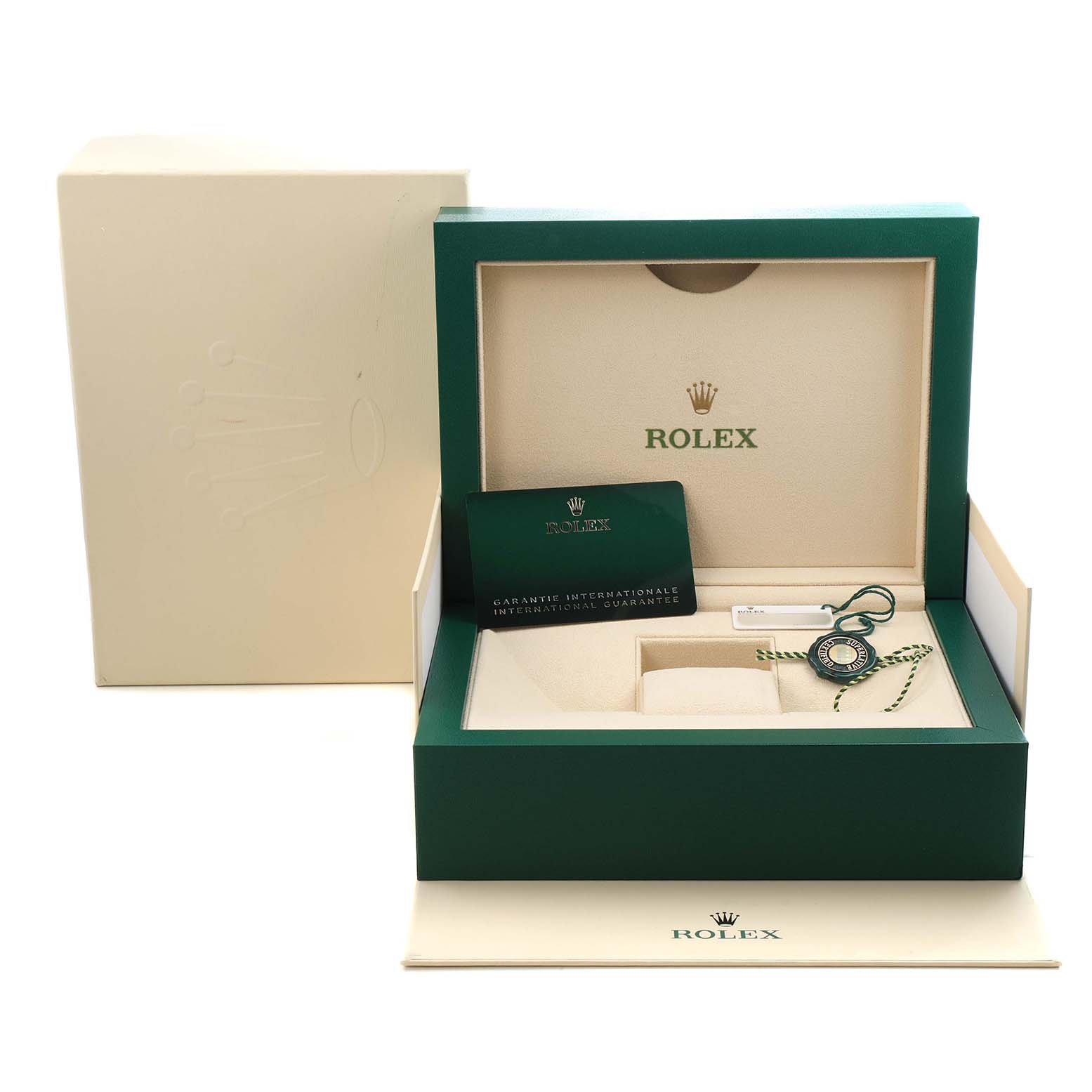 The image shows the packaging and accessories of a Rolex President 128235 Men's Rose Gold Grey Dial model, including the box, warranty card, and tag.