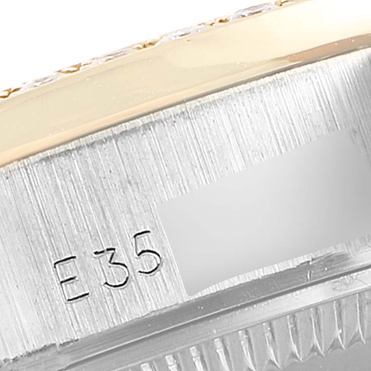 This close-up image shows the side of the bezel and the case with an engraving on the Rolex President 69139 Women's White Gold Brown Dial 69139 Women's White Gold Brown Dial model watch.