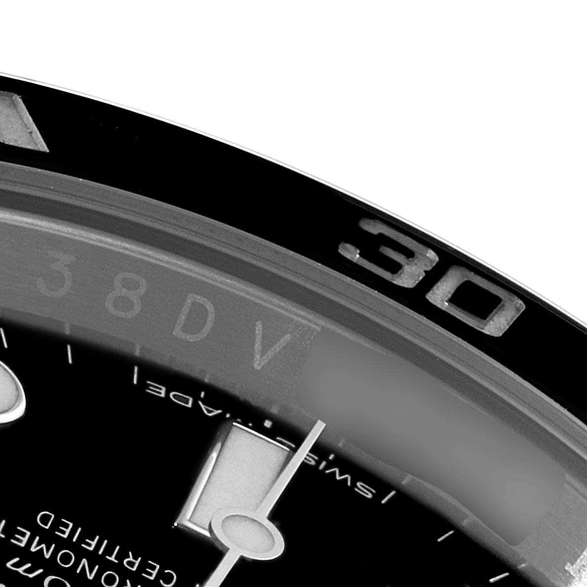 The image shows a close-up of the bezel and a portion of the dial of a Rolex Submariner 114060 Men
s Stainless Steel Black Dial 114060 Men
s Stainless Steel Black Dial watch, including the 30-minute marker.