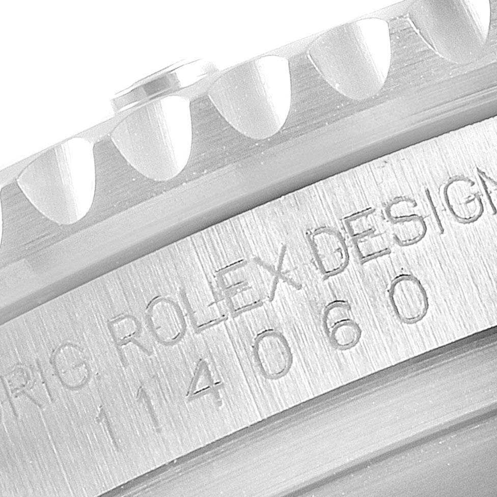 Close-up of the side of a Rolex Submariner 114060 Men
s Stainless Steel Black Dial 114060 Men
s Stainless Steel Black Dial, showing the engraved model number and part of the bezel.