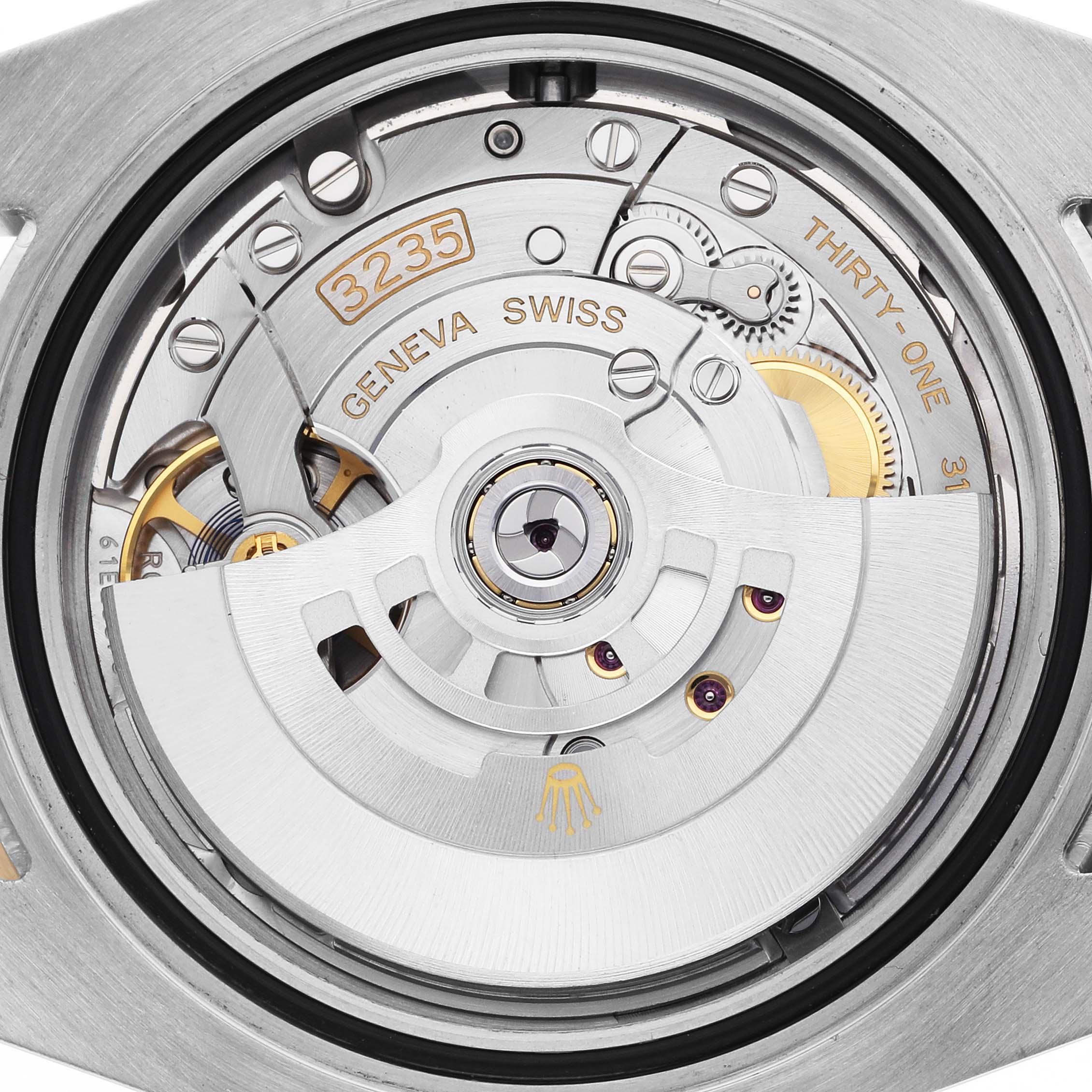 The image shows the movement of a Rolex Submariner 126613LB Men's Steel and Gold (two tone) Blue Dial 126613LB Men's Steel and Gold (two tone) Blue Dial watch, focusing on its intricate mechanical parts and rotor, viewed from the back.