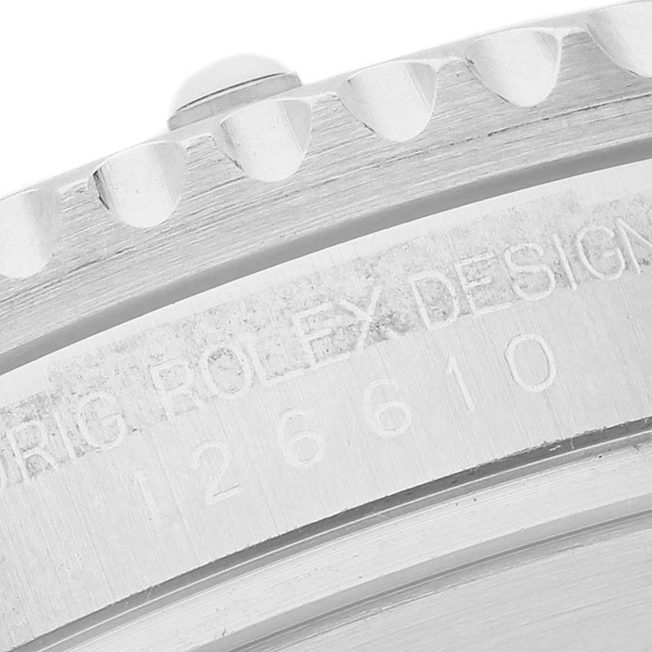 The image shows a close-up of the side of the bezel and engraved case of a Rolex Submariner 126610LN Men's Stainless Steel Black Dial watch.