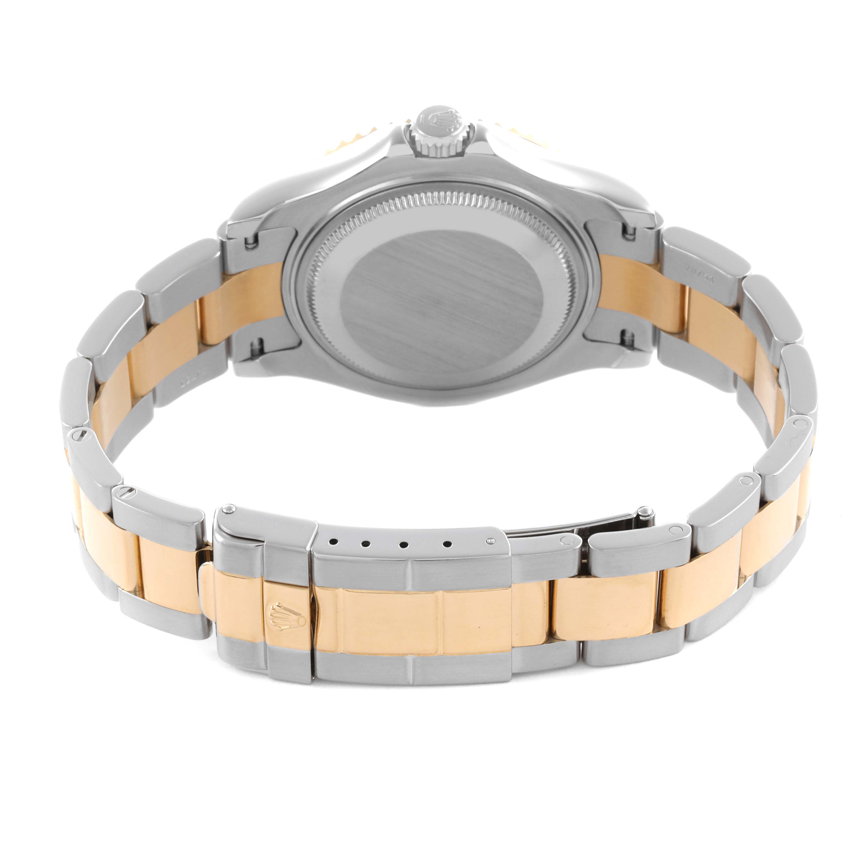 The Rolex Yacht-Master 168623 Men
s Steel and Gold (two tone) White Dial 168623 Men
s Steel and Gold (two tone) White Dial watch is shown from the back, highlighting its case, bezel, and two-tone bracelet with the clasp visible.