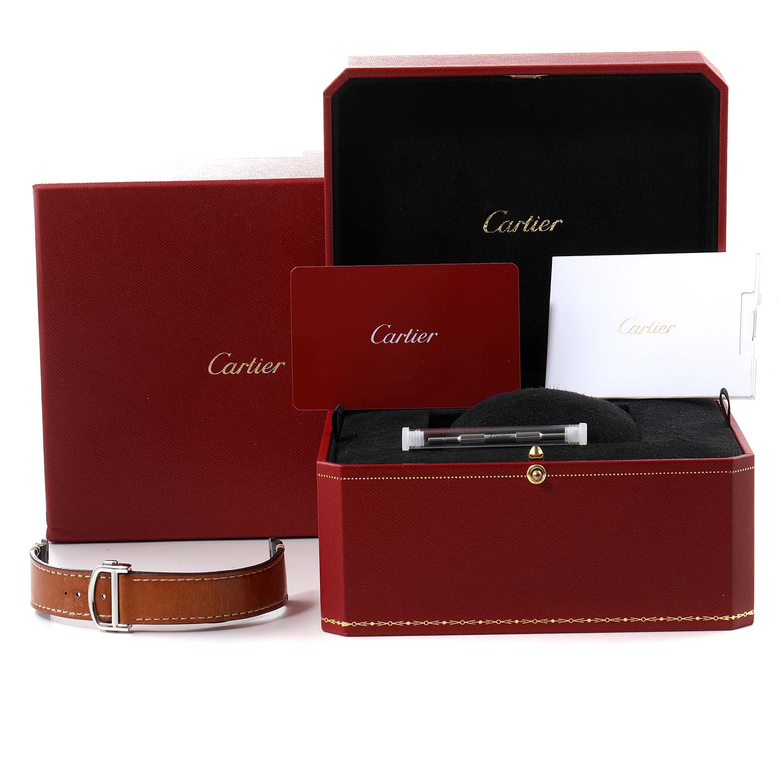 The image shows a Cartier Santos WSSA0018 Men's Stainless Steel Silver Dial WSSA0018 Men's Stainless Steel Silver Dial watch presentation box, extra strap, manual, and a tool for adjusting the strap.