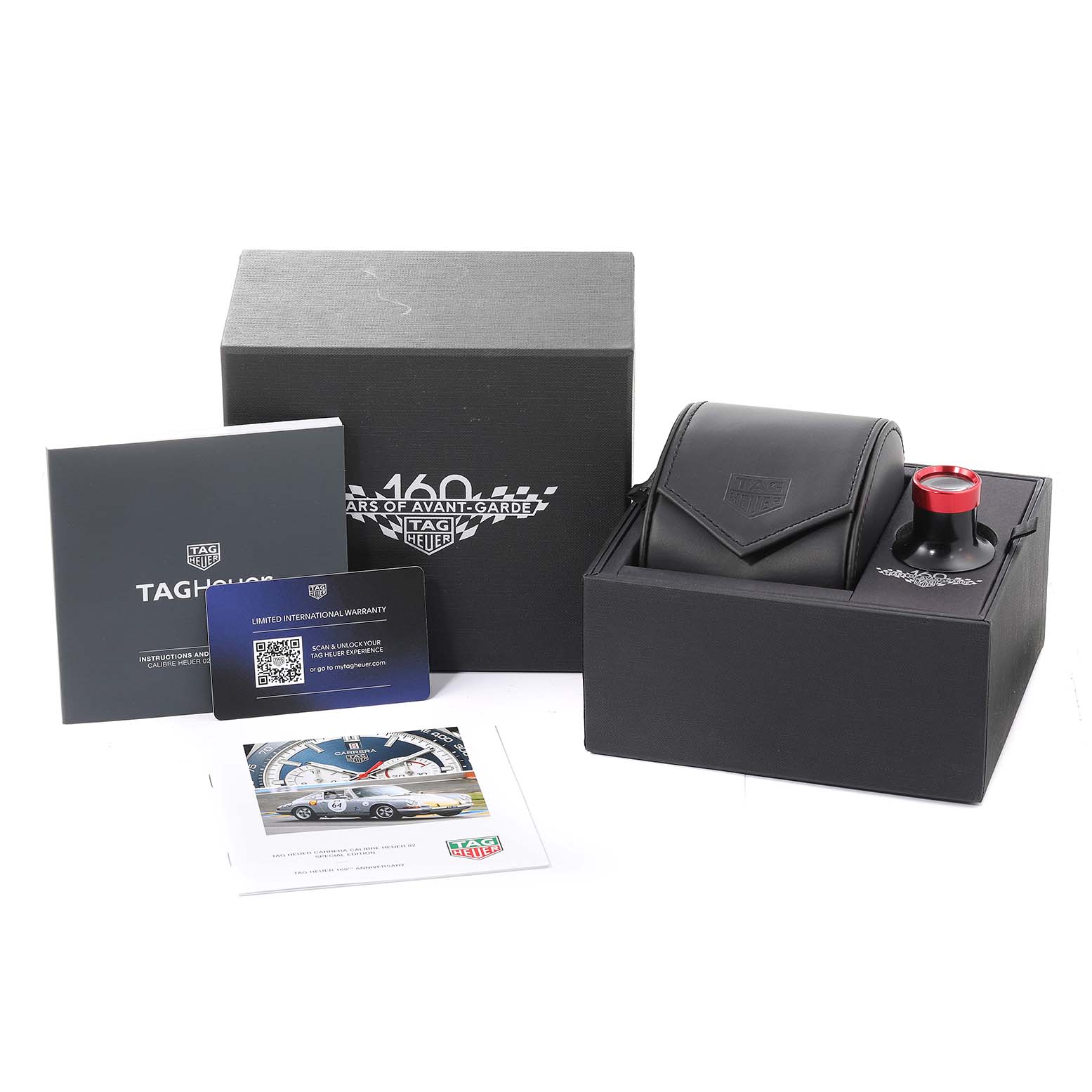 The image shows the Tag Heuer Carrera CBN2A1E.BA0643 Men
s Stainless Steel Blue Dial CBN2A1E.BA0643 Men
s Stainless Steel Blue Dial model packaging, including its box, warranty card, and accessory pouch.