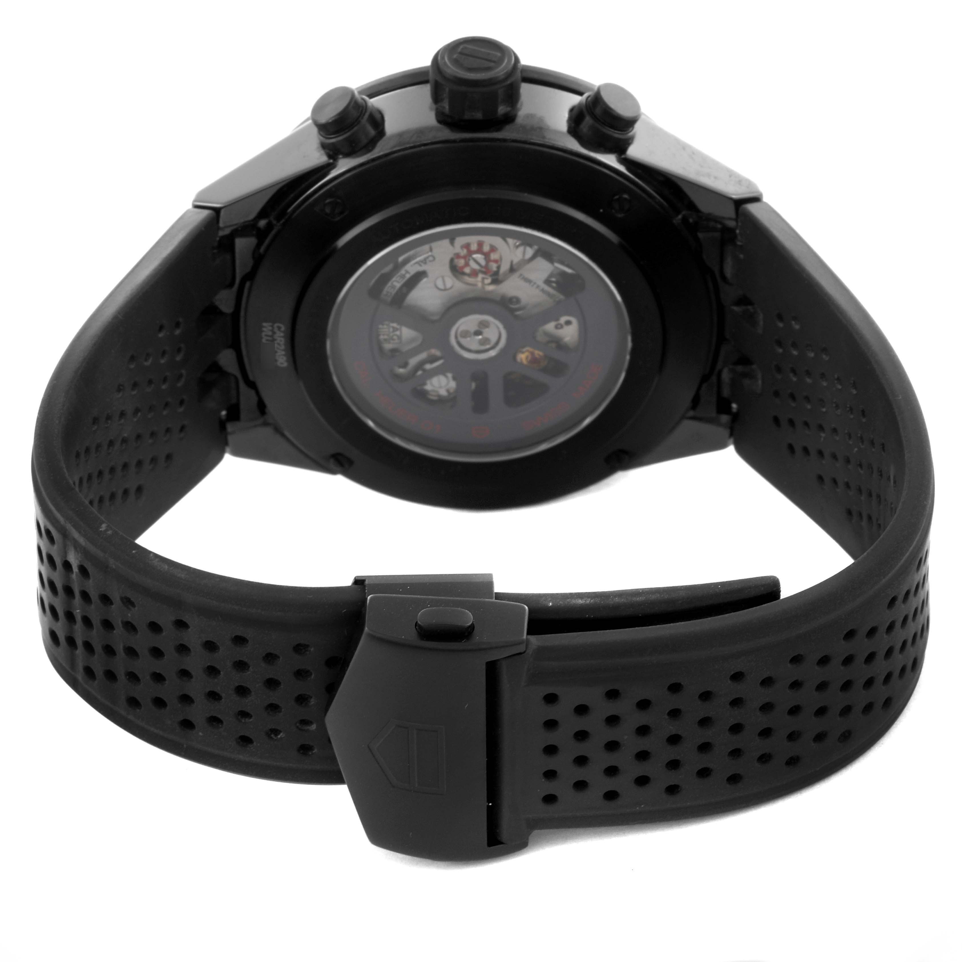 The Tag Heuer Carrera CAR2A90.FT6071 Men's Ceramic Black Dial CAR2A90.FT6071 Men's Ceramic Black Dial watch is shown from the back, featuring its clasp, strap, and clear case back.