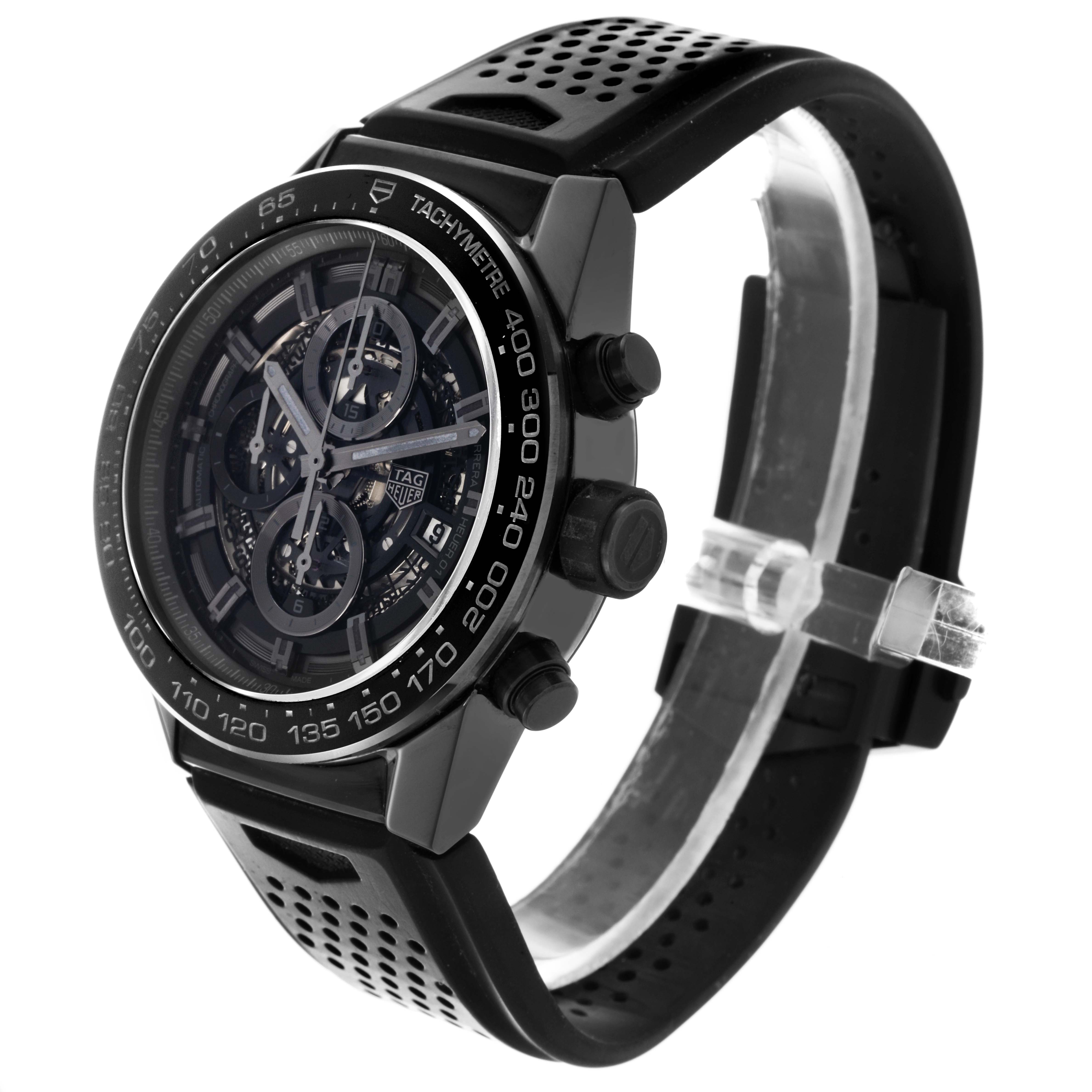 The Tag Heuer Carrera CAR2A90.FT6071 Men's Ceramic Black Dial CAR2A90.FT6071 Men's Ceramic Black Dial watch is shown at a slight angle, highlighting the face, tachymeter bezel, and perforated strap.