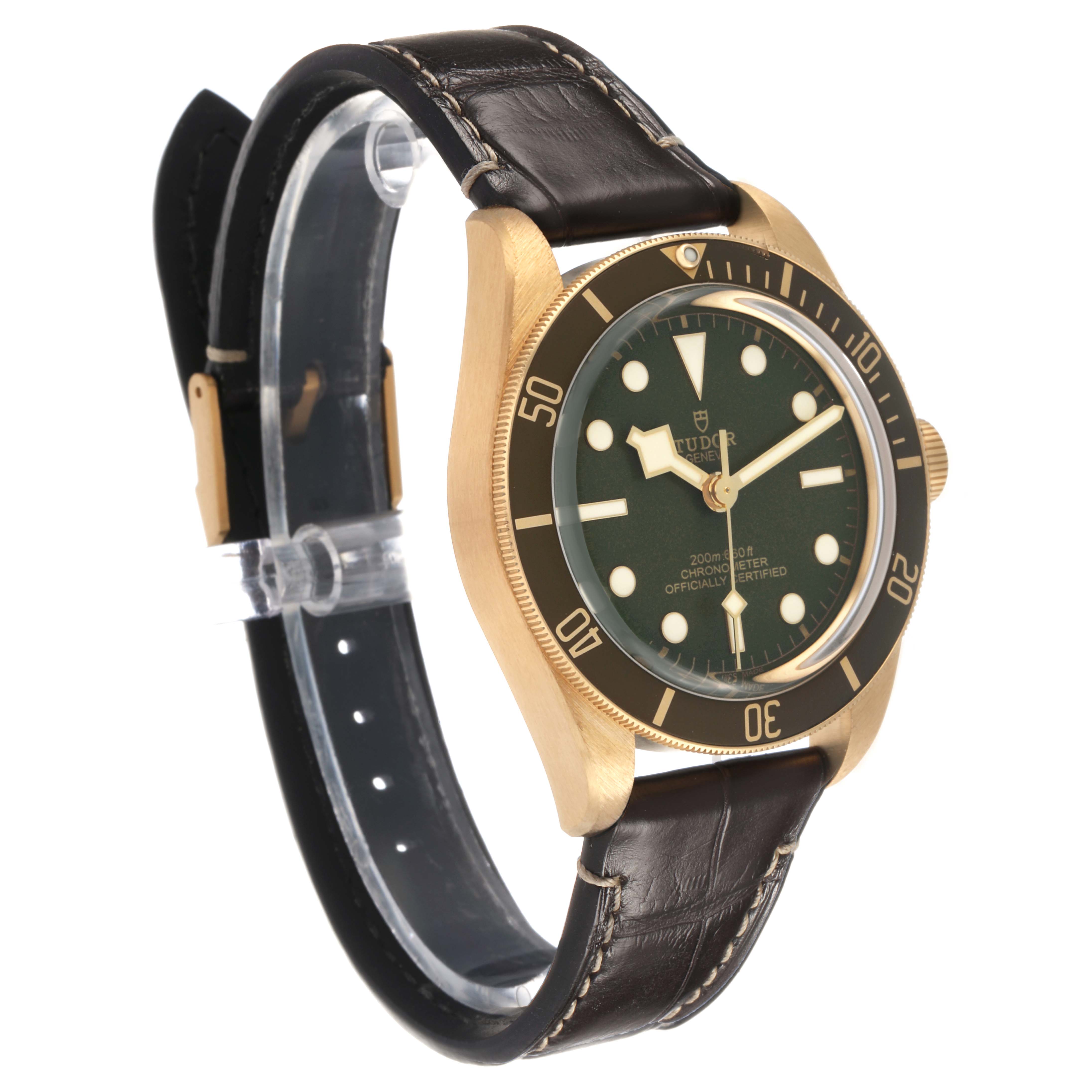 The Tudor Heritage Black Bay M79018V-0001 Men's Yellow Gold Green Dial watch is shown at a slight angle, displaying the face, bezel, crown, and leather strap.