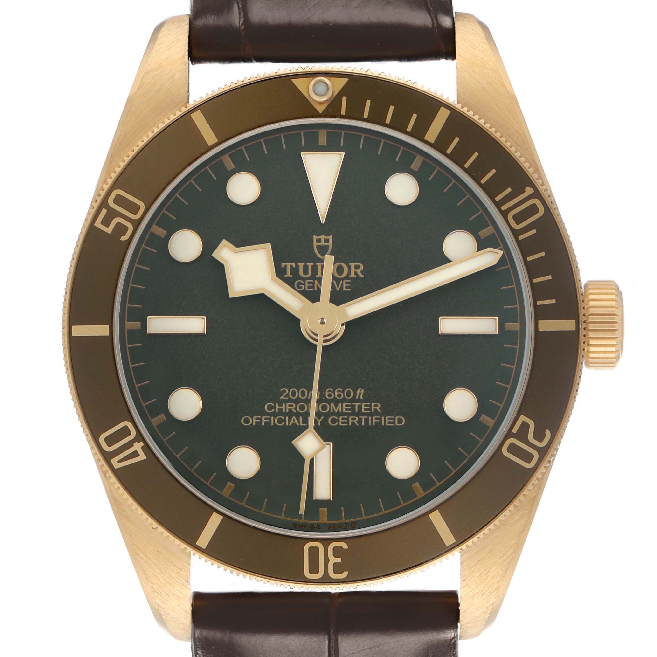 The image shows a front view of the Tudor Heritage Black Bay M79018V-0001 Men's Yellow Gold Green Dial watch, featuring the face, bezel, and part of the leather strap.