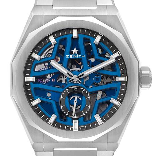 The image shows a Zenith Defy 03.9300.3620 Men's Stainless Steel Blue Dial watch from a front angle, highlighting its blue skeleton dial and stainless steel case.