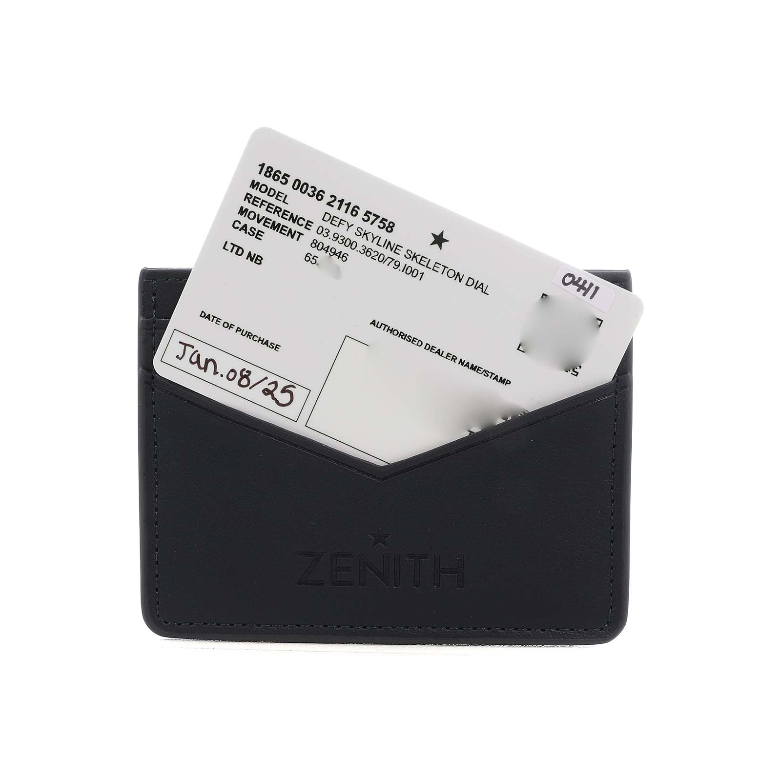 The image shows a Zenith Defy 03.9300.3620 Men's Stainless Steel Blue Dial model warranty card partially inserted in a black Zenith-branded cardholder.