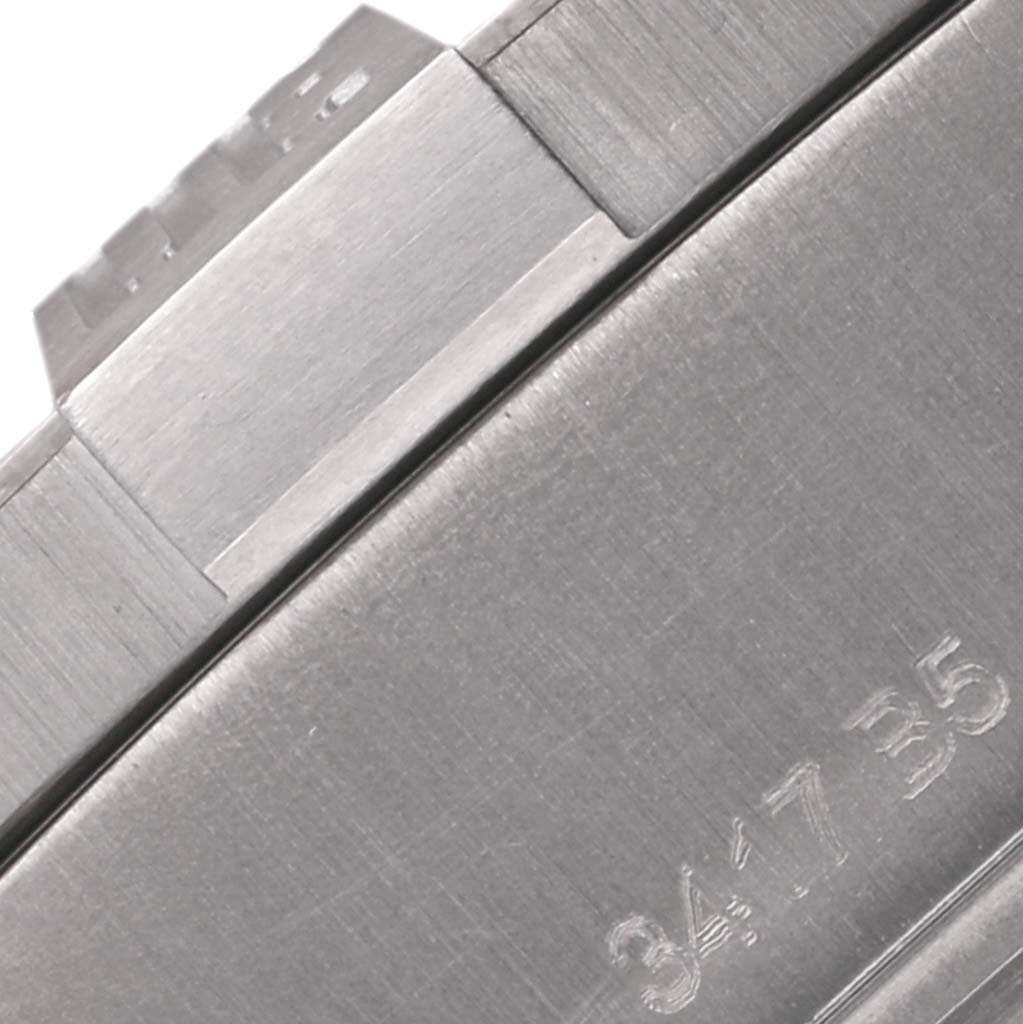 This close-up image of the Breitling Avenger E1338310/M536-109W Men's Titanium Grey Dial E1338310/M536-109W Men's Titanium Grey Dial watch shows part of the clasp and band, highlighting the brushed metal finish.