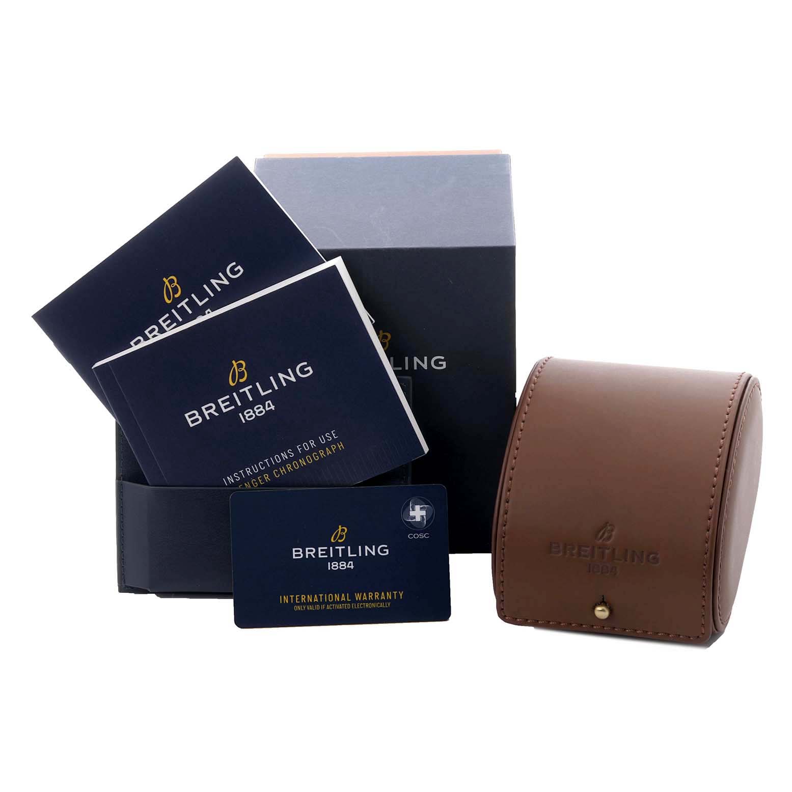 The image shows a Breitling Avenger A13317101B1A1 Men's Stainless Steel Black Dial box set with booklets, a warranty card, and a brown watch case, viewed from the front.