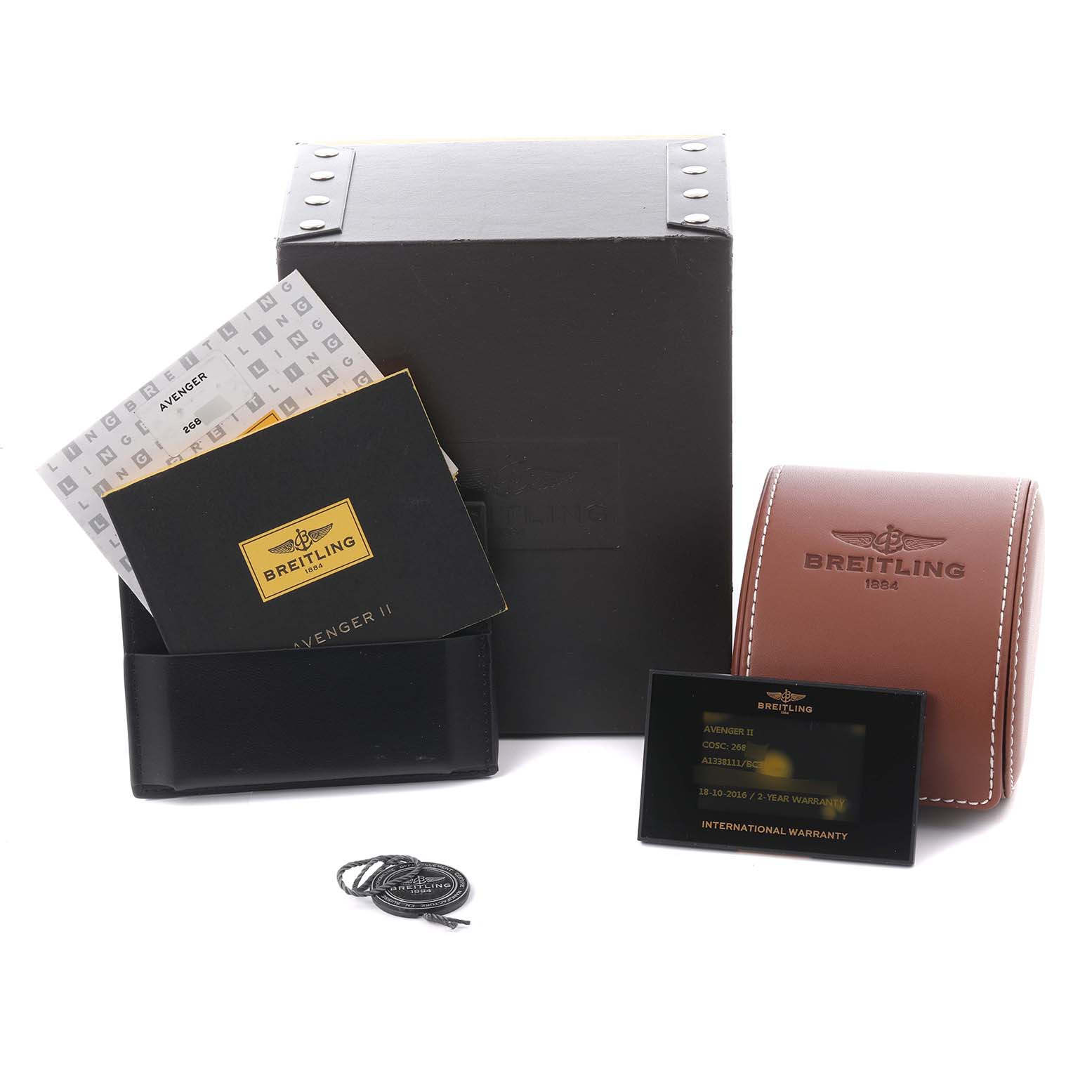 The image shows the Breitling Avenger A13381 Men's Stainless Steel Black Dial A13381 Men's Stainless Steel Black Dial model's box, warranty card, manuals, and a leather pouch from a front angle.