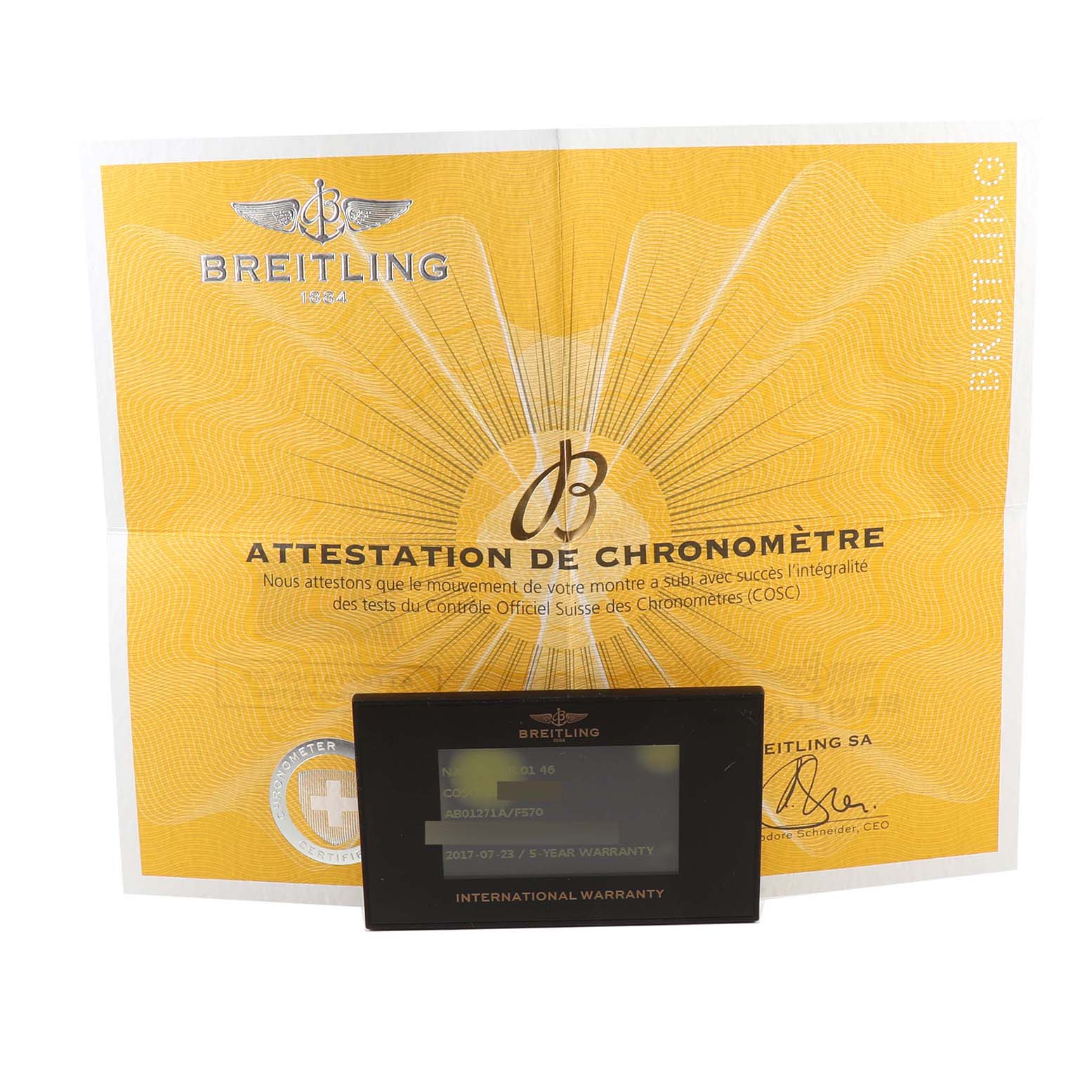 The image shows the certificate of chronometer attestation and the international warranty card for the Limited Series model by Breitling.