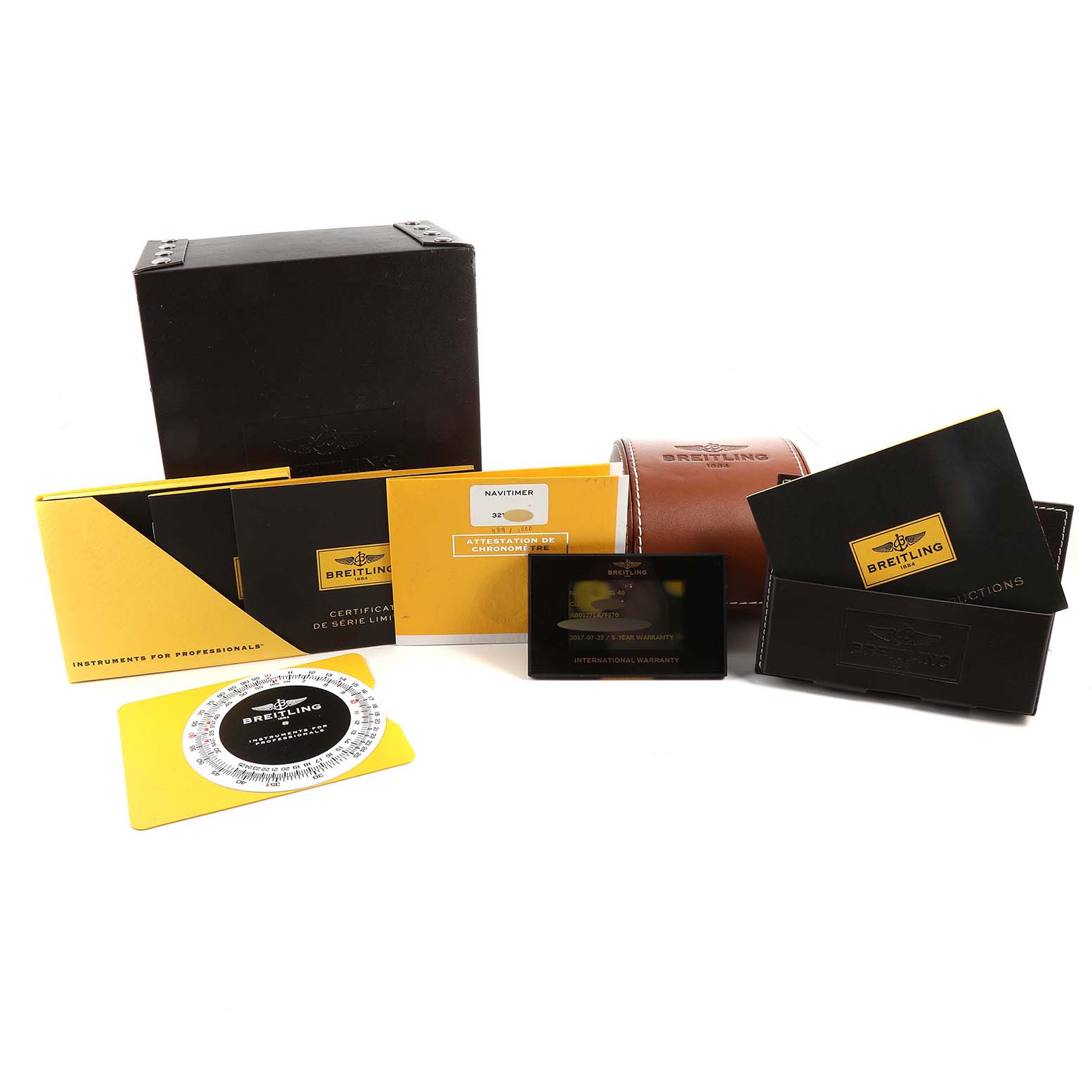The image displays the box, warranty card, user manual, certificate, and carrying case for a Breitling Limited Series watch model.